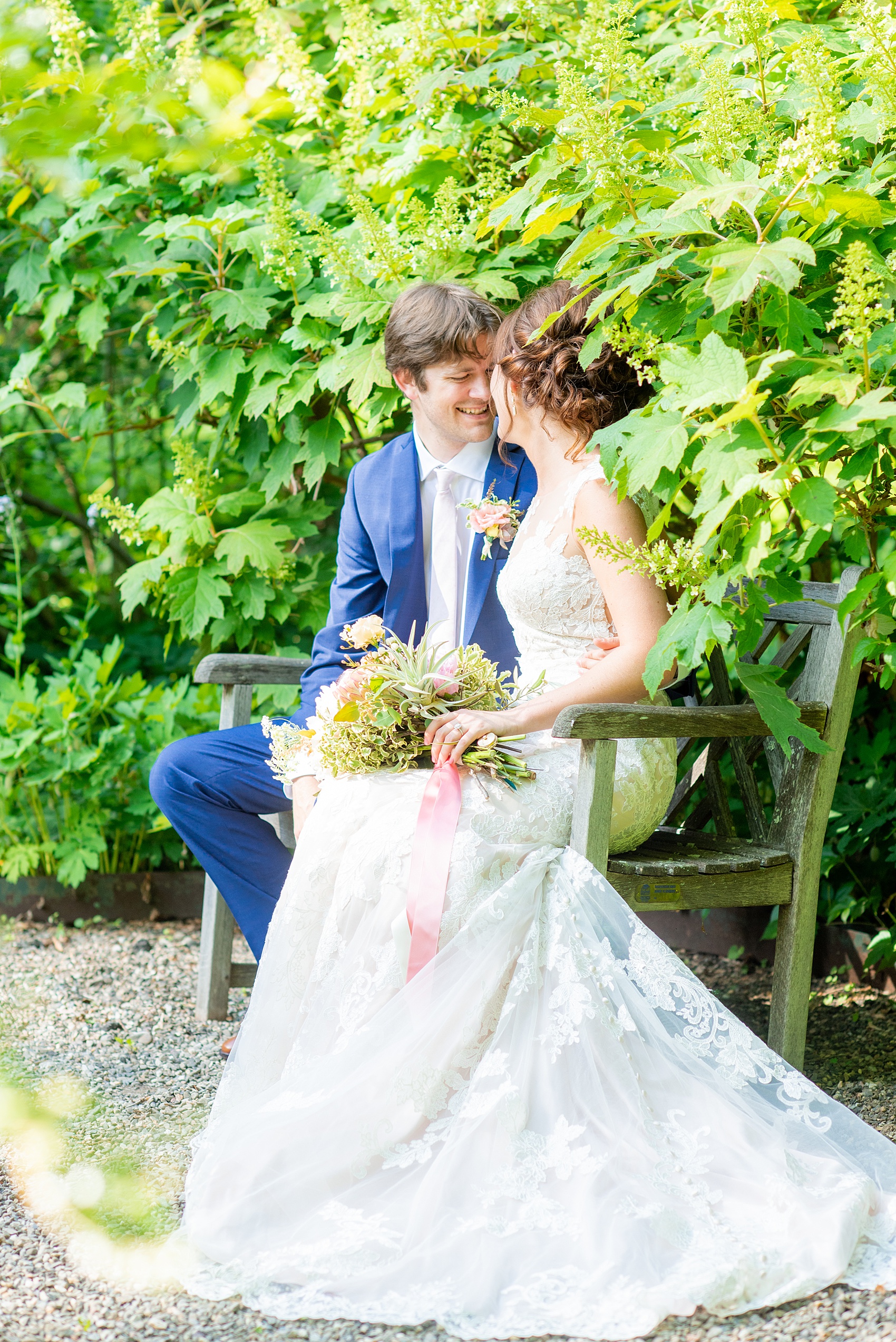 A summer wedding at Olde Mill Inn, NJ. Photos by Mikkel Paige Photography for an event with pink and blue details. The bride and groom chose to have their photos taken at Cross Estate Gardens, just down the road from this New Jersey Venue. Click through for their complete wedding recap! #OldeMillInn #NJwedding #NJweddingphotographer #mikkelpaige #NewJerseyWeddingVenue #NewJerseyWedding #CrossEstateGardens #brideandgroom 