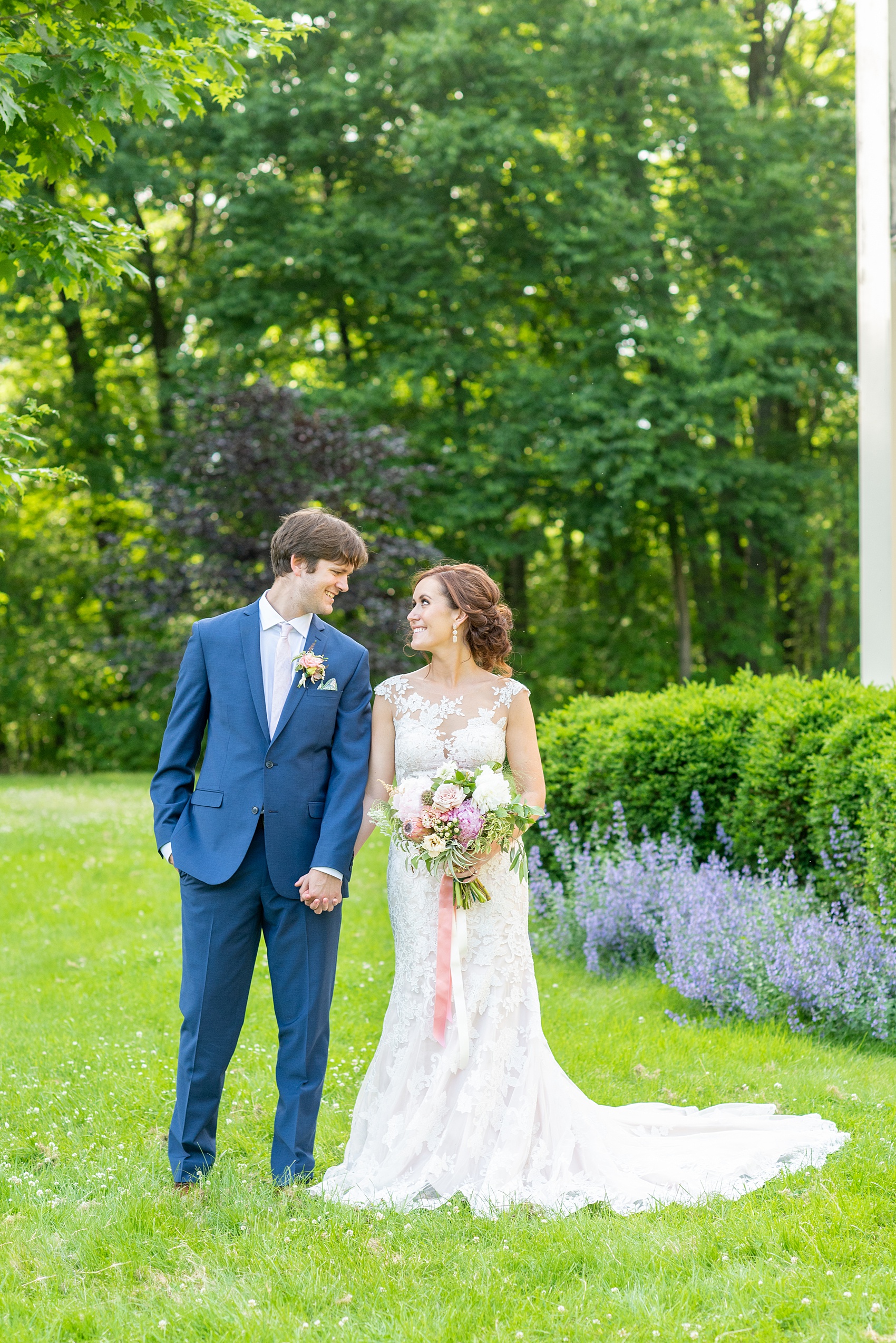 A summer wedding at Olde Mill Inn, NJ. Photos by Mikkel Paige Photography for an event with pink and blue details. The bride and groom chose to have their photos taken at Cross Estate Gardens, just down the road from this New Jersey Venue. Click through for their complete wedding recap! #OldeMillInn #NJwedding #NJweddingphotographer #mikkelpaige #NewJerseyWeddingVenue #NewJerseyWedding #CrossEstateGardens #brideandgroom 