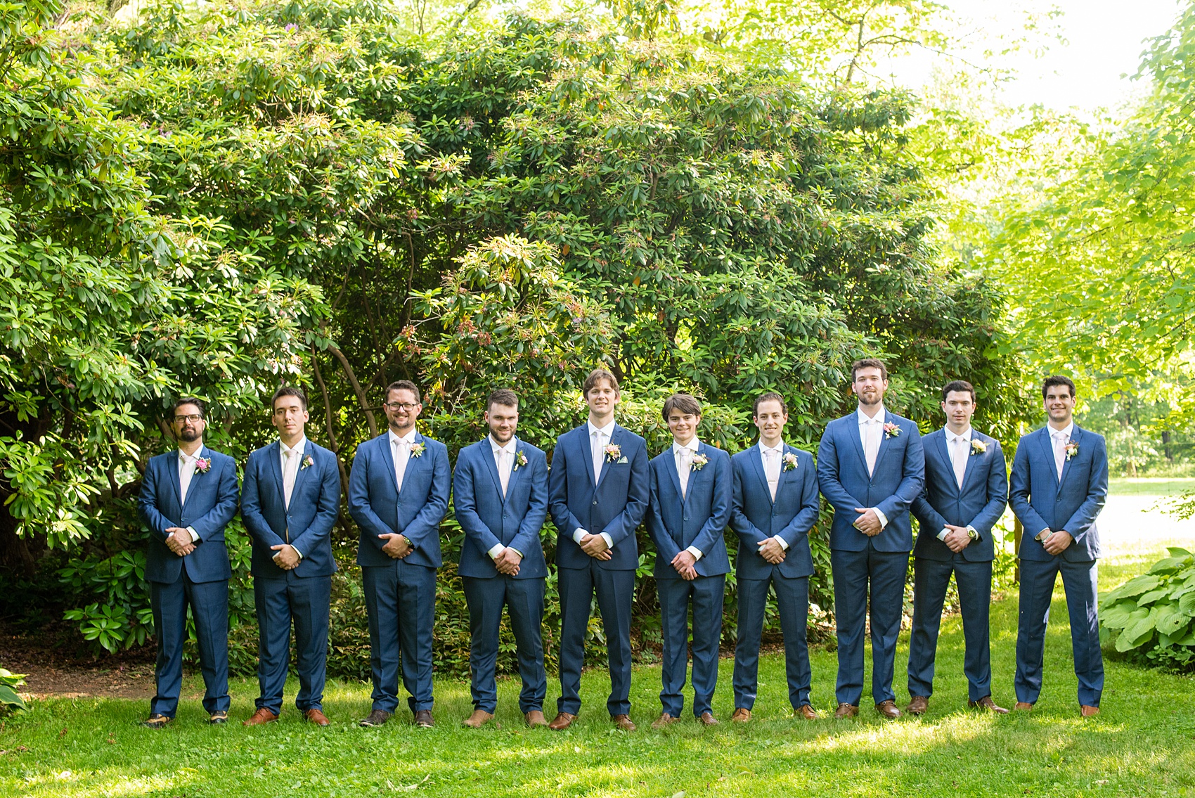 A summer wedding at Olde Mill Inn, NJ. Photos by Mikkel Paige Photography. This New Jersey venue is a great option for an event not too far from NYC. The wedding party photos were at nearby Cross Estate Gardens, a beautiful lush area for bridal party and groomsmen photos. The guys wore blue suits with pink ties. Click through for their complete wedding recap! #OldeMillInn #NJwedding #NJweddingphotographer #mikkelpaige #NewJerseyWeddingVenue #NewJerseyWedding #CrossEstateGardens #weddingdetails #bridalparty #bluesuits #groomsmen