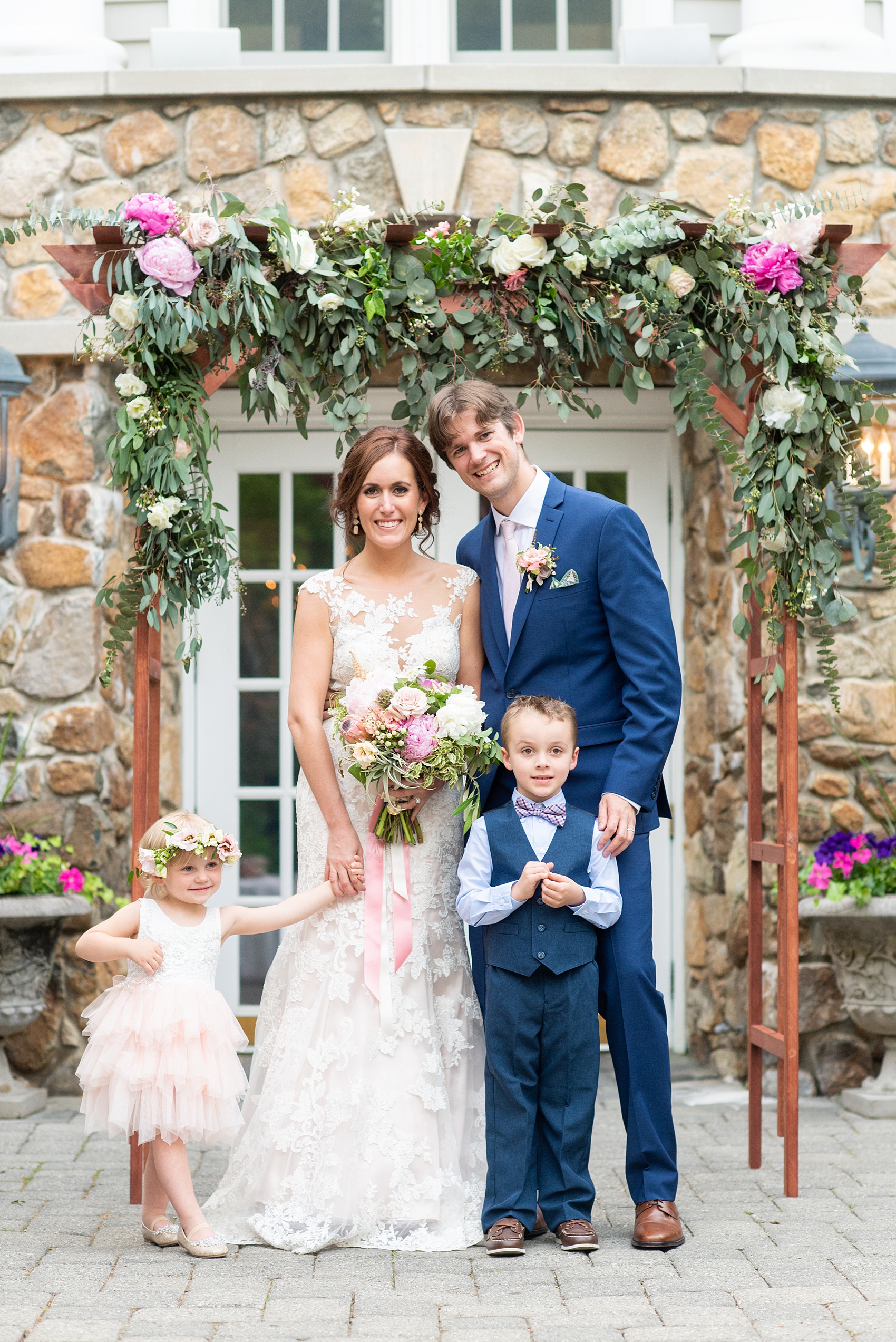 A summer wedding at Olde Mill Inn, NJ. Photos by Mikkel Paige Photography for an event with light pink and blue details. This New Jersey venue is a great option for something not too far from NYC. The couple had their ceremony in the interior courtyard and had an adorable flower girl and ring bearer. Click through for their complete wedding recap! #OldeMillInn #NJwedding #NJweddingphotographer #mikkelpaige #NewJerseyWeddingVenue #NewJerseyWedding #CrossEstateGardens 