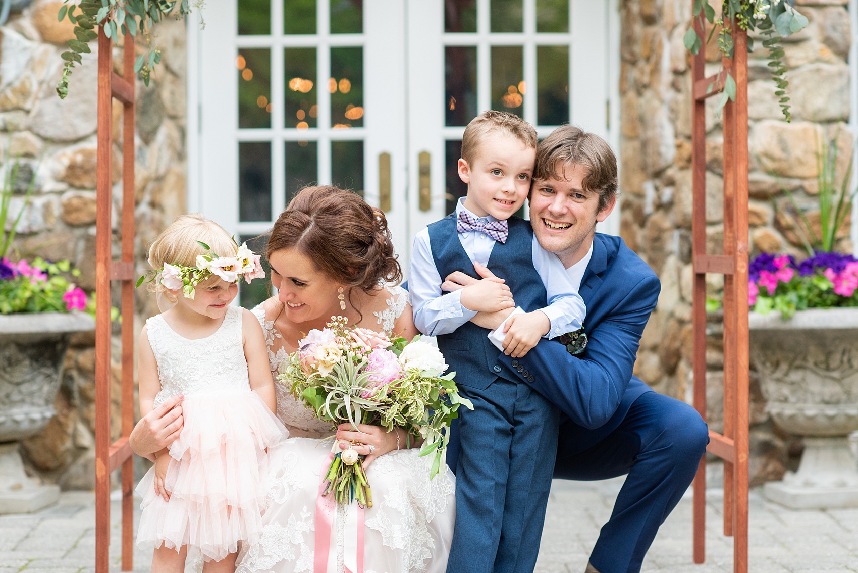 A summer wedding at Olde Mill Inn, NJ. Photos by Mikkel Paige Photography for an event with light pink and blue details. This New Jersey venue is a great option for something not too far from NYC. The couple had their ceremony in the interior courtyard and had an adorable flower girl and ring bearer. Click through for their complete wedding recap! #OldeMillInn #NJwedding #NJweddingphotographer #mikkelpaige #NewJerseyWeddingVenue #NewJerseyWedding #CrossEstateGardens 