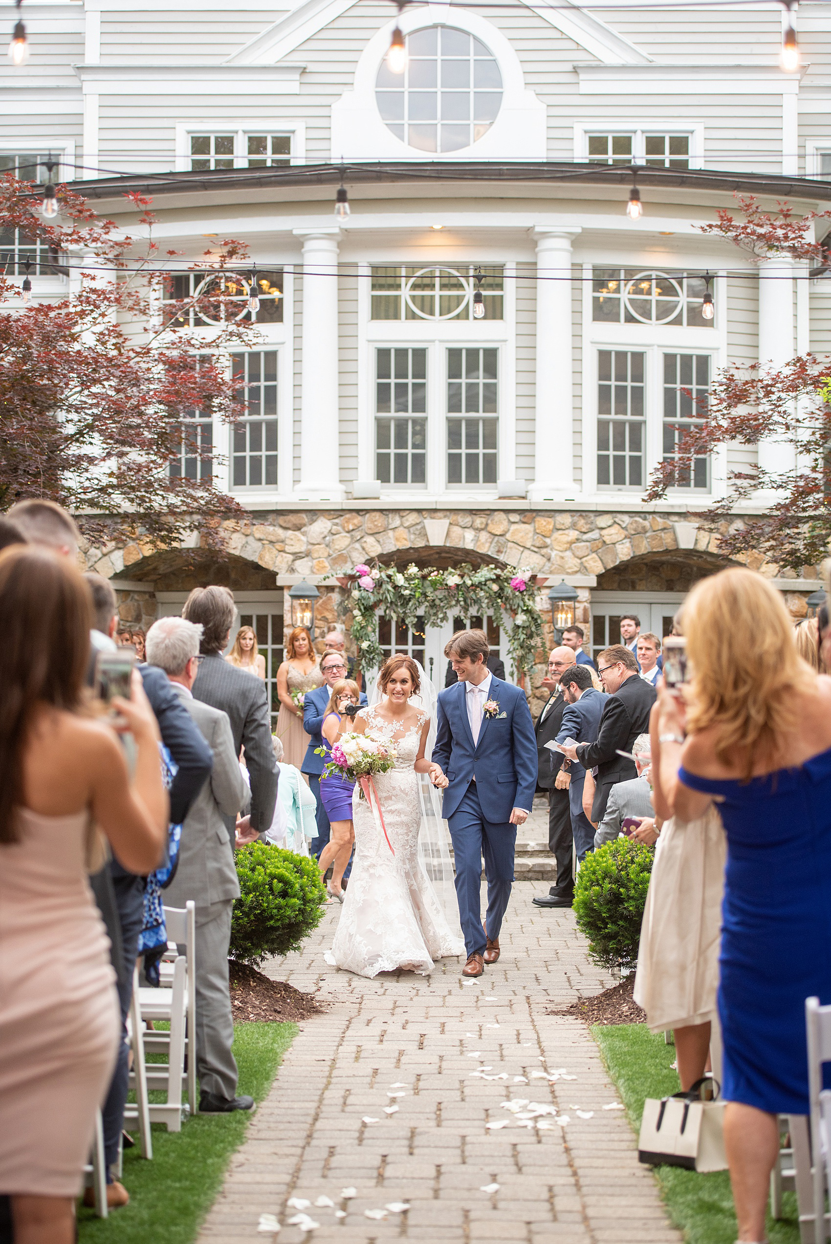 A summer wedding at Olde Mill Inn, NJ. Photos by Mikkel Paige Photography for an event with light pink and blue details. This New Jersey venue is a great option for something not too far from NYC. The couple had their ceremony in the interior courtyard. Click through for their complete wedding recap! #OldeMillInn #NJwedding #NJweddingphotographer #mikkelpaige #NewJerseyWeddingVenue #NewJerseyWedding #CrossEstateGardens 