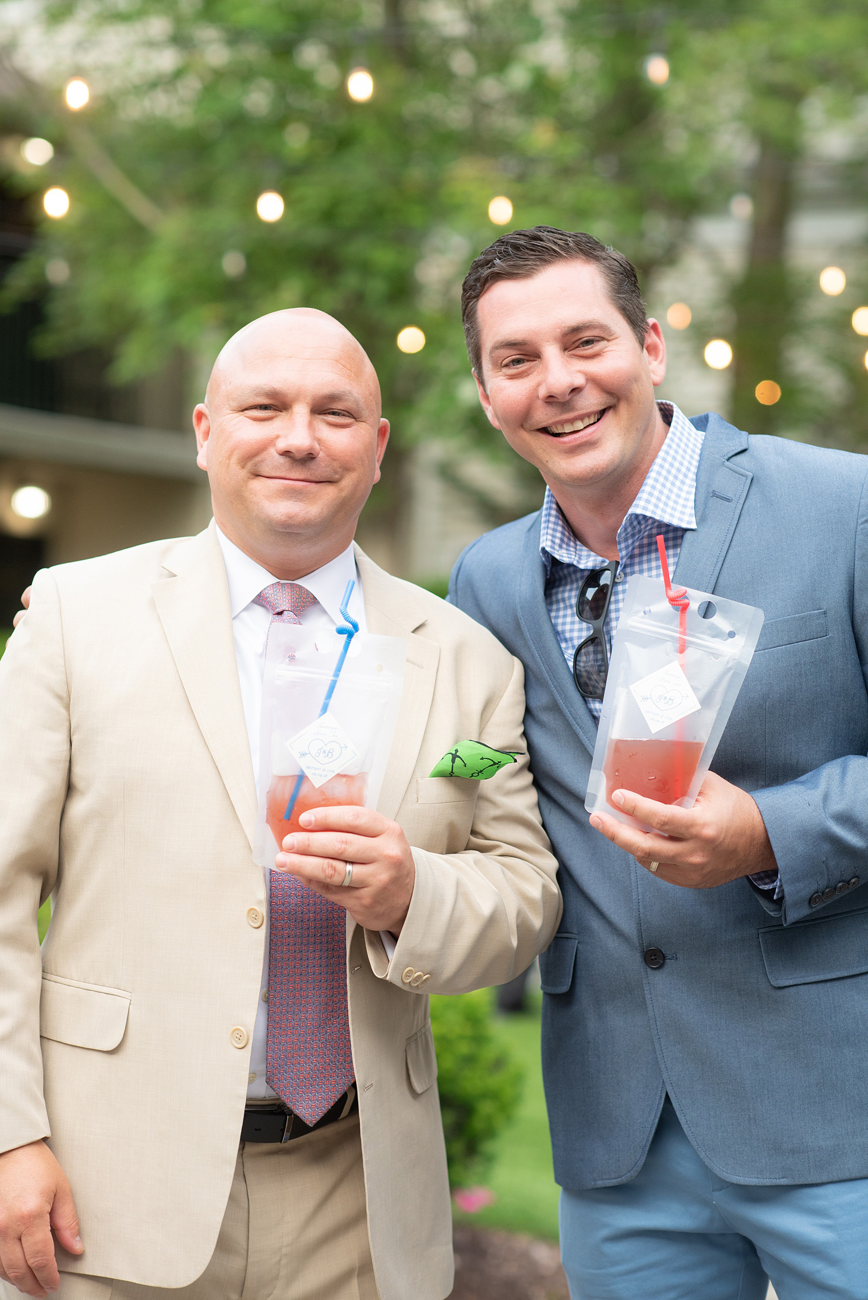 A June wedding at Olde Mill Inn, NJ. Photos by Mikkel Paige Photography for an event with pink details. This New Jersey venue is a great option for something not too far from NYC. Their signature drink was served in an IV bag of sorts, a play on the bride being a doctor! It was perfect for fruity sangria! Click through for their complete wedding recap! #OldeMillInn #NJwedding #NJweddingphotographer #mikkelpaige #NewJerseyWeddingVenue #NewJerseyWedding #signaturedrink #uniqueweddingdetails #MidsummerNightsDream