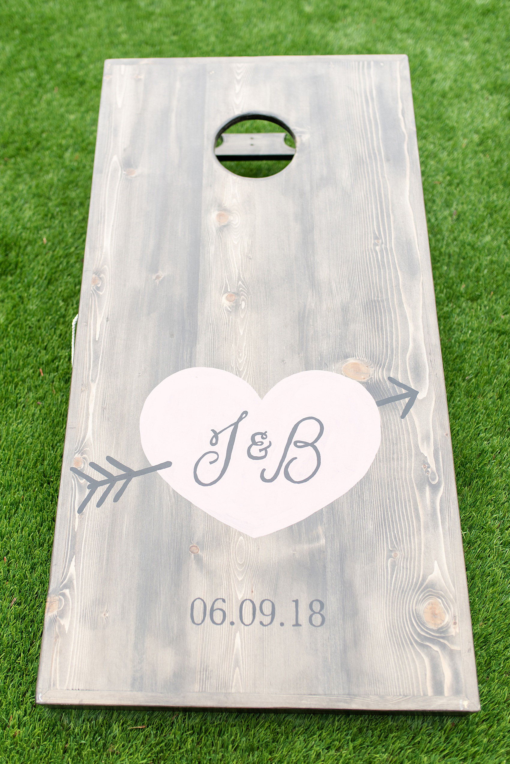 A June wedding at Olde Mill Inn, NJ. Photos by Mikkel Paige Photography for an event with pink details. This New Jersey venue is a great option for something not too far from NYC. Their custom corn hole boards matched their wedding logo and signature heart! Even the flower girl enjoyed playing during cocktail hour! Click through for their complete wedding recap! #OldeMillInn #NJwedding #NJweddingphotographer #mikkelpaige #NewJerseyWeddingVenue #NewJerseyWedding #cornhole #customweddingdetails #weddinglogo #uniqueweddingdetails #MidsummerNightsDream