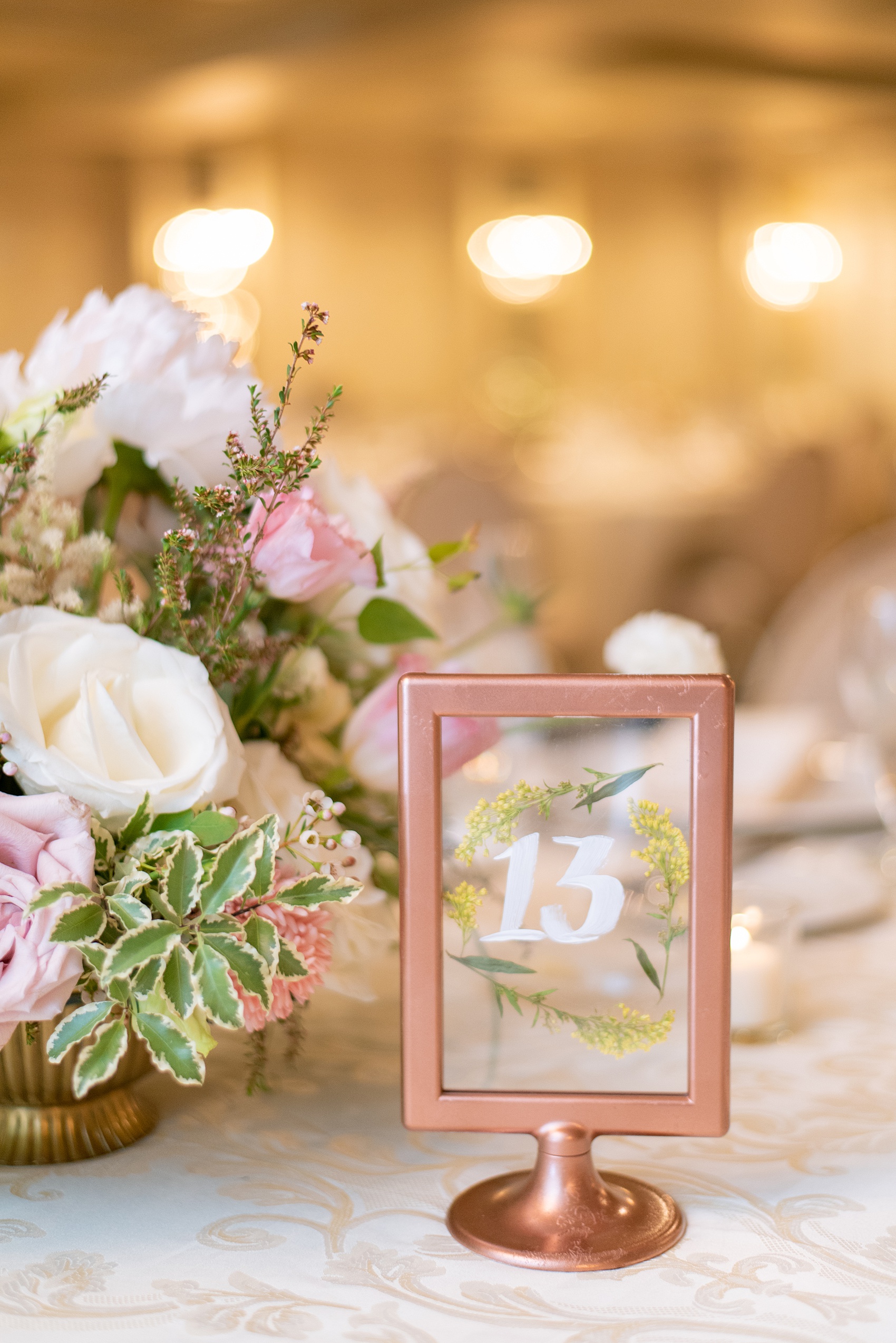 A June wedding at Olde Mill Inn, NJ. Photos by Mikkel Paige Photography for an event with pink details. This New Jersey venue is a great option for something not too far from NYC. The table numbers were written on glass within rose gold frames and had pressed flowers inside o match their Midsummer Night’s Dream theme. Click through for their complete wedding recap! #OldeMillInn #NJwedding #NJweddingphotographer #mikkelpaige #NewJerseyWeddingVenue #NewJerseyWedding #tablenumbers #pressedflowers #rosegoldwedding #MidsummerNightsDream