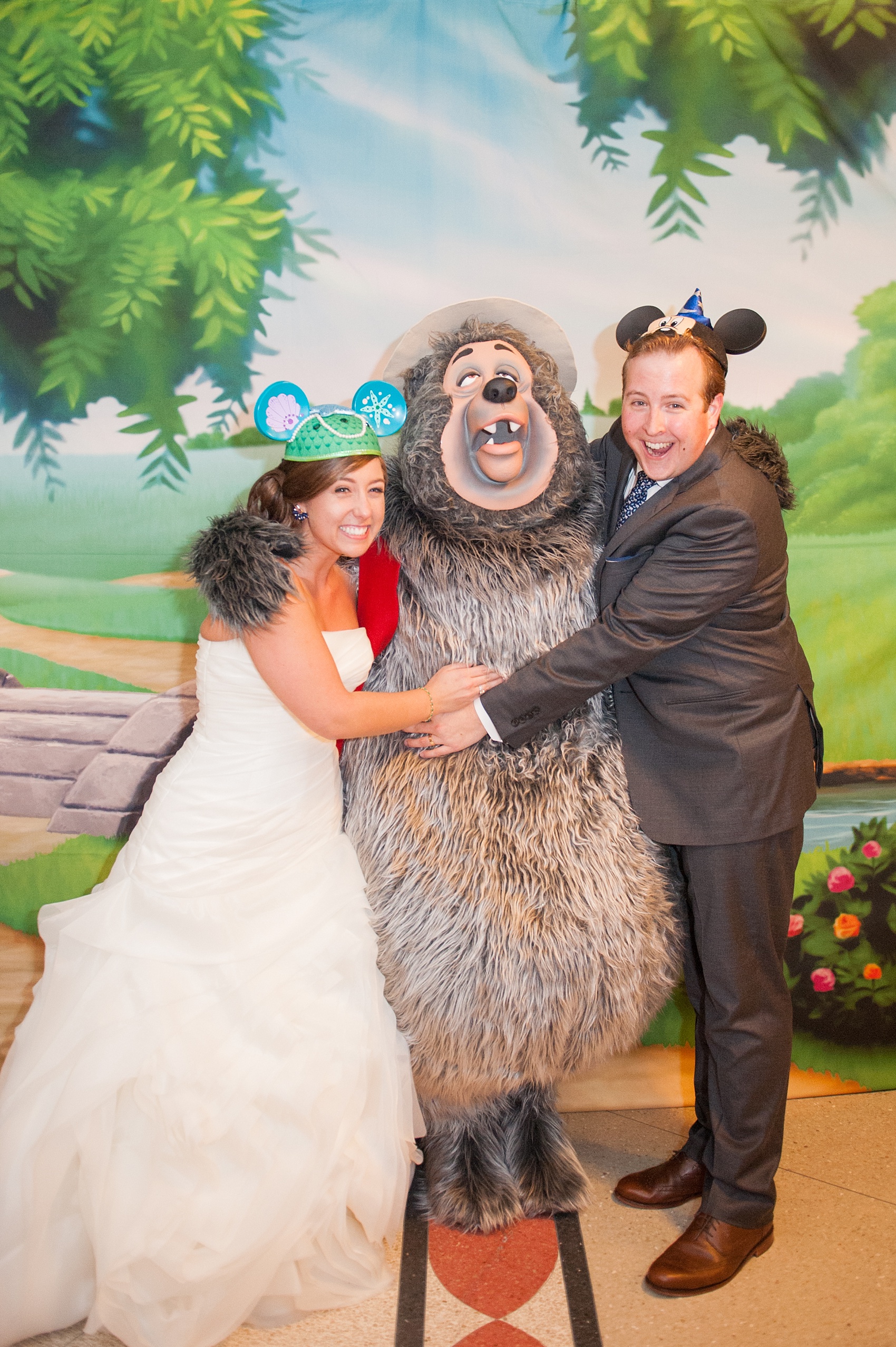 Walt Disney World wedding pictures at the Boardwalk venue, including a waterfront ceremony and Dance Hall reception near Epcot. These photos will give you unique, fun ideas from Glow in the Dark invitations to having Big Al from Country Bear Jamboree as a wedding guest! Want to see more? Click through to Mikkel Paige Photography for more inspiration from this bride and groom's colorful day! #DisneyWedding #mikkelpaige #disneysboardwalk #DisneyWeddingVenue #DisneyBride #DisneyFan #MickeyEars #CountryBearJamboree