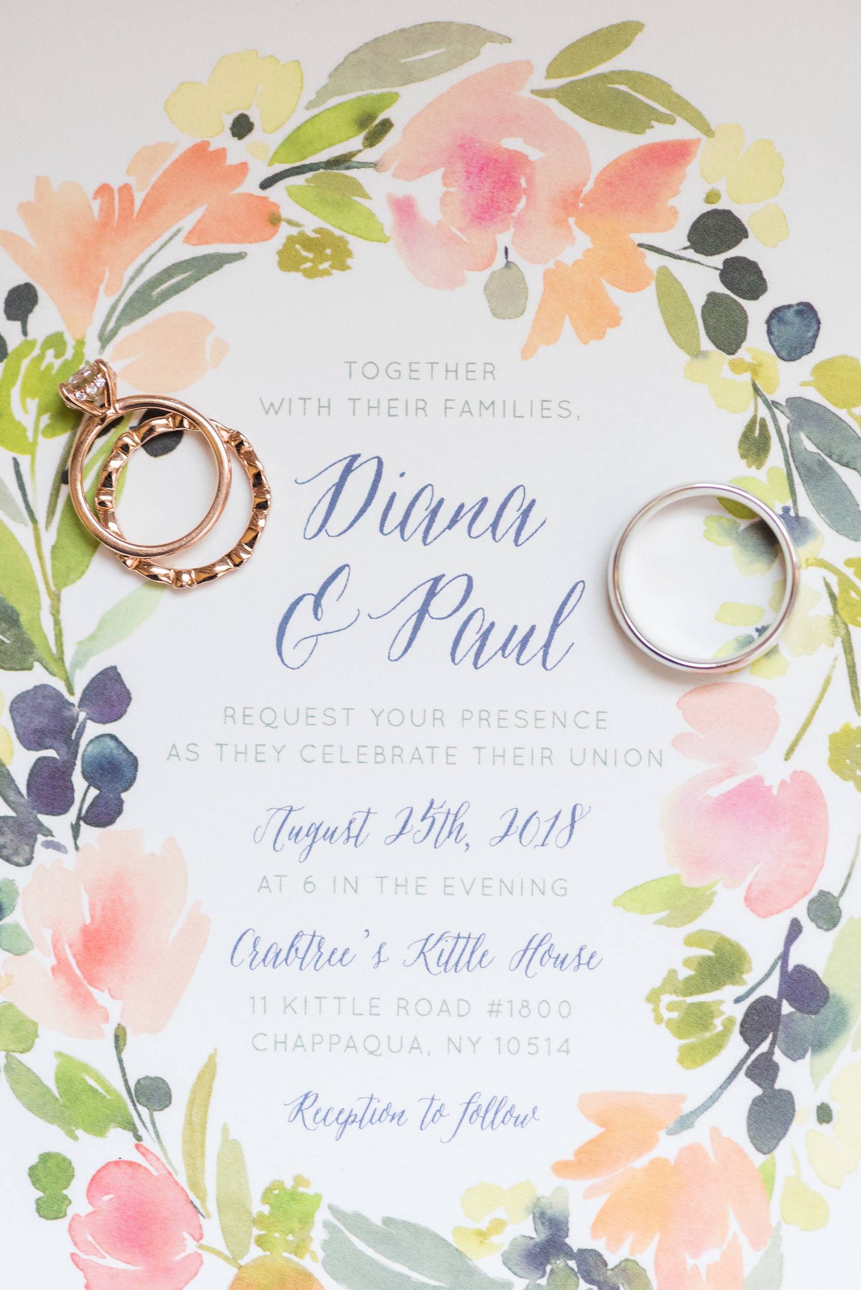 Wedding photos at Crabtree's Kittle House in Chappaqua, New York by Mikkel Paige Photography. This detail image shows the bride and groom's watercolor inspired invitation from Minted with their rose and white gold rings. Click through to see more details from this gorgeous day! #mikkelpaige #CrabtreesKittleHouse #WestchesterWeddingVenues #WestchesterWedding #summerwedding #weddingdetails #weddinginvitation #mintedinvitation #watercolorinvitation #weddingstationery #weddingrings #rosegold