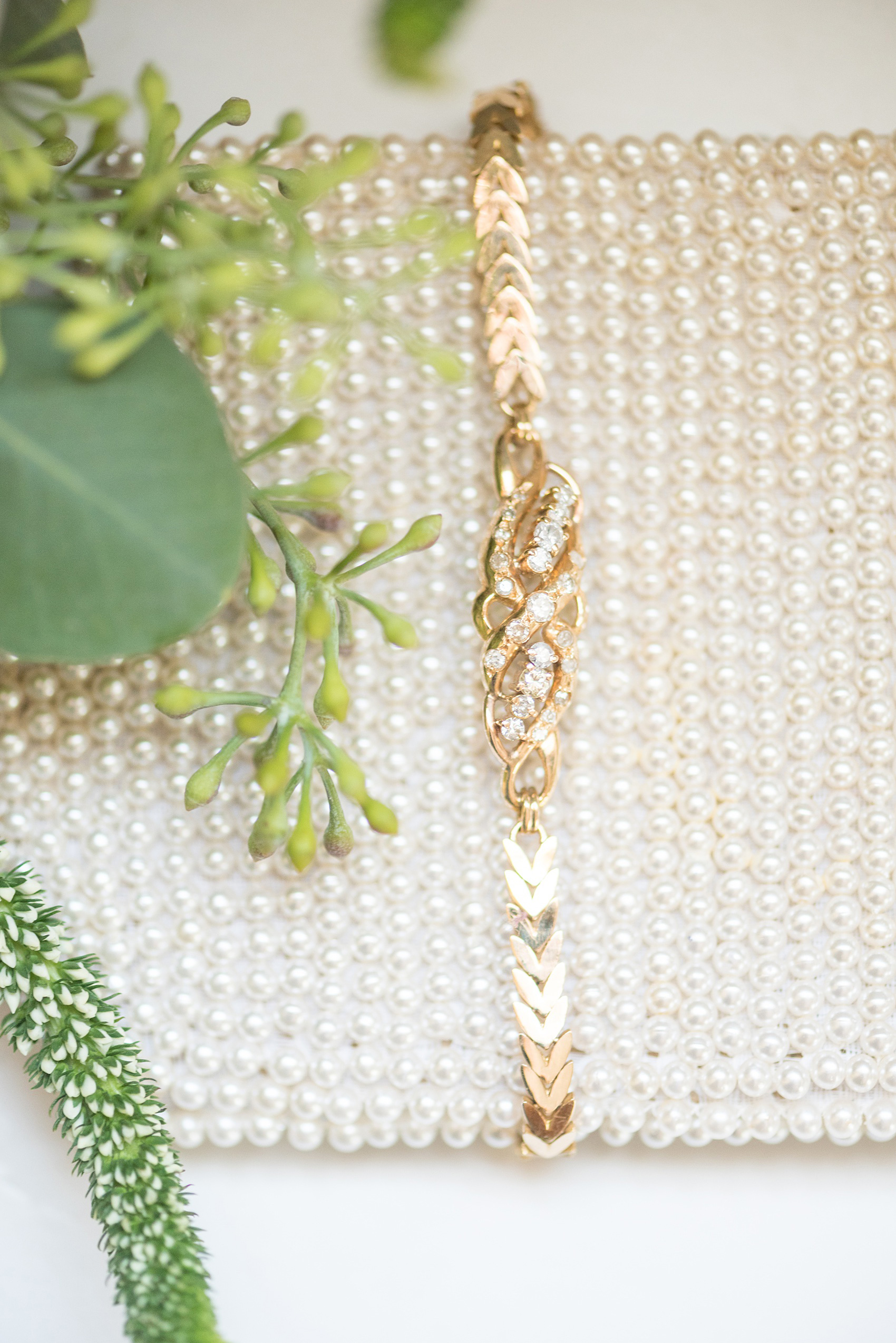 Wedding photos at Crabtree's Kittle House in Chappaqua, New York by Mikkel Paige Photography. This detail image shows the bride's gold and diamond bracelet her mom gifted to her. Click through to see more details from this gorgeous day! #mikkelpaige #CrabtreesKittleHouse #AsianWeddingTraditions #WestchesterWeddingVenues #WestchesterWedding #summerwedding #weddingdetails #bride #gettingready #weddinggettingready #motherofthebride #goldanddiamondbracelet