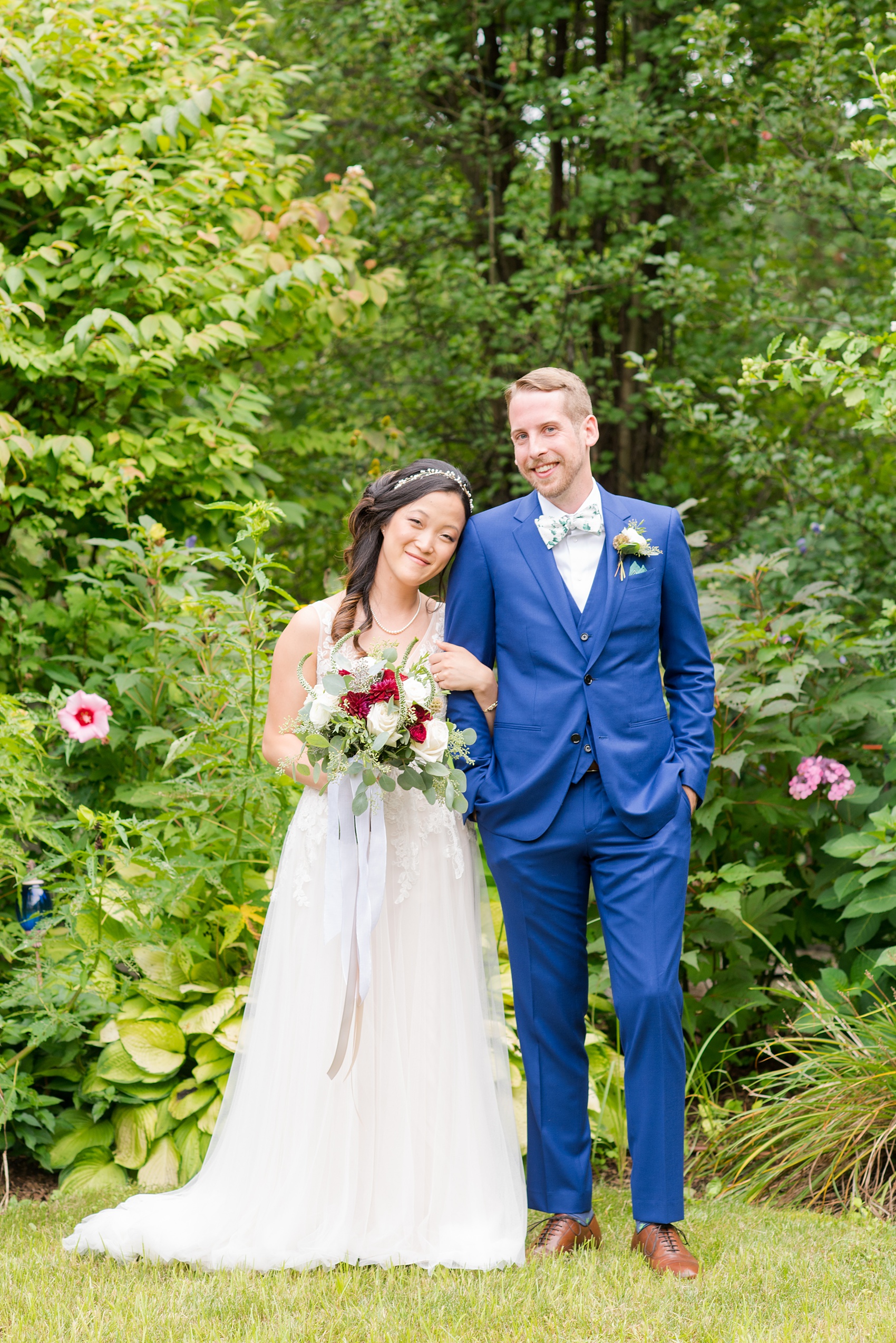 Wedding photos at Crabtree's Kittle House in Chappaqua, New York by Mikkel Paige Photography. This venue in Westchester county was the perfect place for a summer wedding. The groom wore a custom blue Indochino suit and the bride a tulle BHDLN gown. Click through for more awesome details from the day! #bluesuit #BHLDNgown #mikkelpaige #CrabtreesKittleHouse #WestchesterWeddingVenues #WestchesterWedding #summerwedding #CustomSuit #PatternBowTie