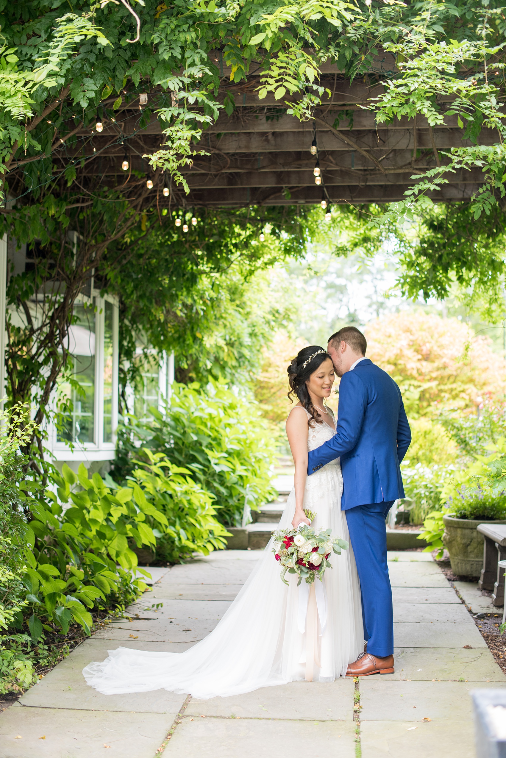 Wedding photos at Crabtree's Kittle House in Chappaqua, New York by Mikkel Paige Photography. This venue in Westchester county has the perfect elegance of a rustic home and garden very close to NYC. The bride wore a gown from BHLDN and groom a custom blue Indochino suit. #bluesuit #BHLDNgown #mikkelpaige #CrabtreesKittleHouse #WestchesterWeddingVenues #WestchesterWedding #summerwedding 