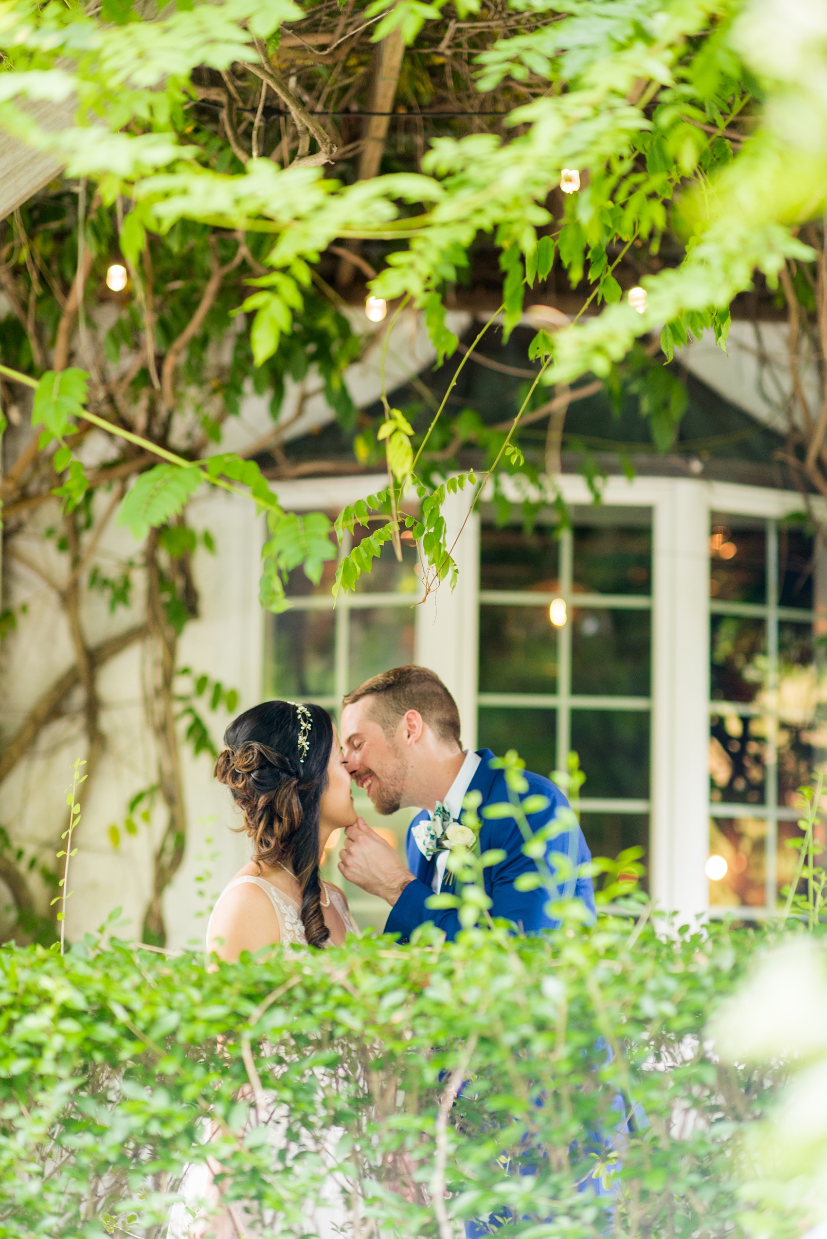 Wedding photos at Crabtree's Kittle House in Chappaqua, New York by Mikkel Paige Photography. This venue in Westchester county has the perfect elegance of a historic home very close to NYC. The bride and groom stole a kiss in the garden! Click through for more summer wedding inspiration from their day! #mikkelpaige #CrabtreesKittleHouse #WestchesterWeddingVenues #WestchesterWedding #summerwedding #brideandgroom