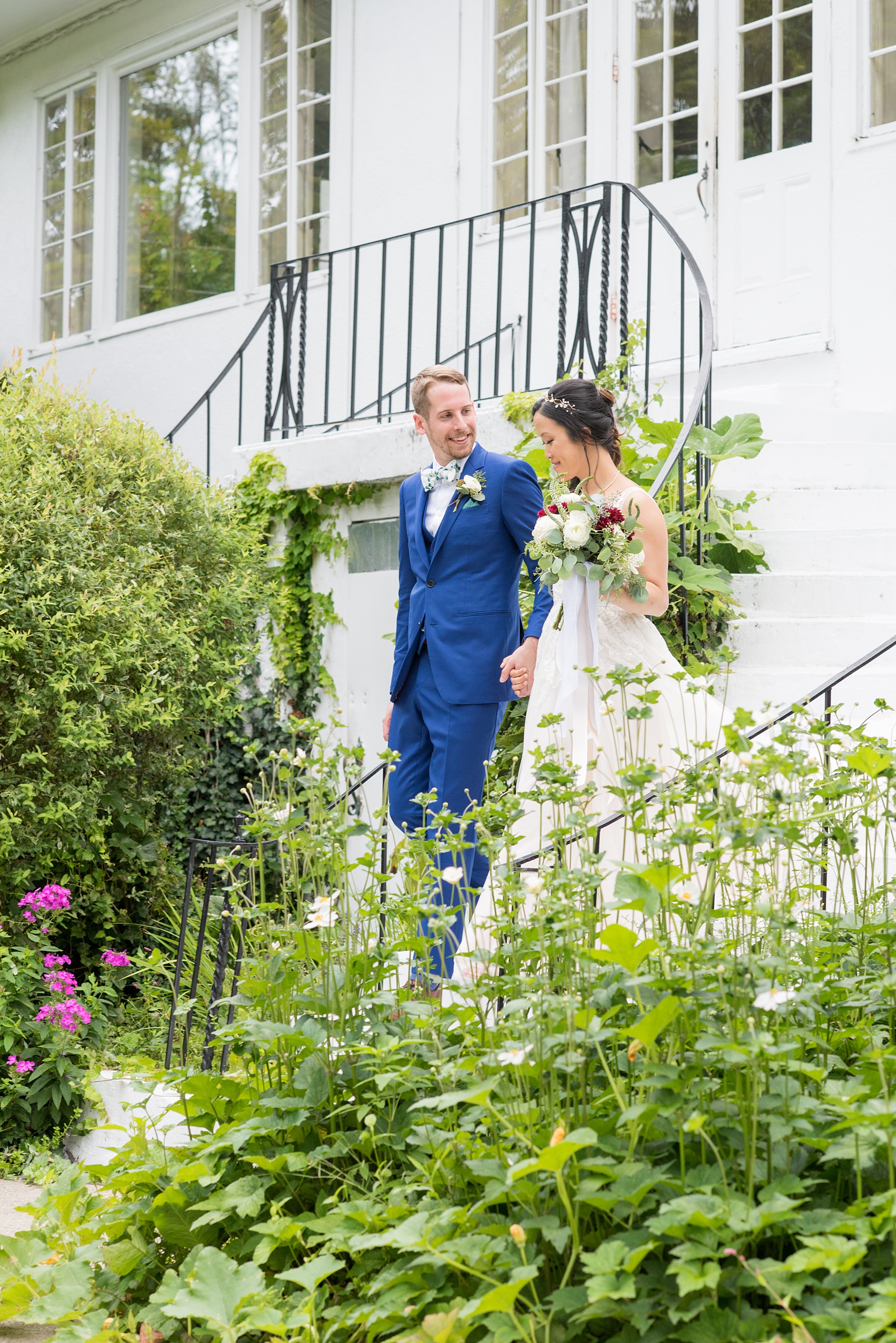 Wedding photos at Crabtree's Kittle House in Chappaqua, New York by Mikkel Paige Photography. This venue in Westchester county has the perfect elegance of a historic home and garden very close to NYC. The bride wore a gown from BHLDN and groom a custom blue Indochino suit. Click through for more summer wedding inspiration from their day! #bluesuit #BHLDNgown #mikkelpaige #CrabtreesKittleHouse #WestchesterWeddingVenues #WestchesterWedding #AsianBride #summerwedding #brideandgroom