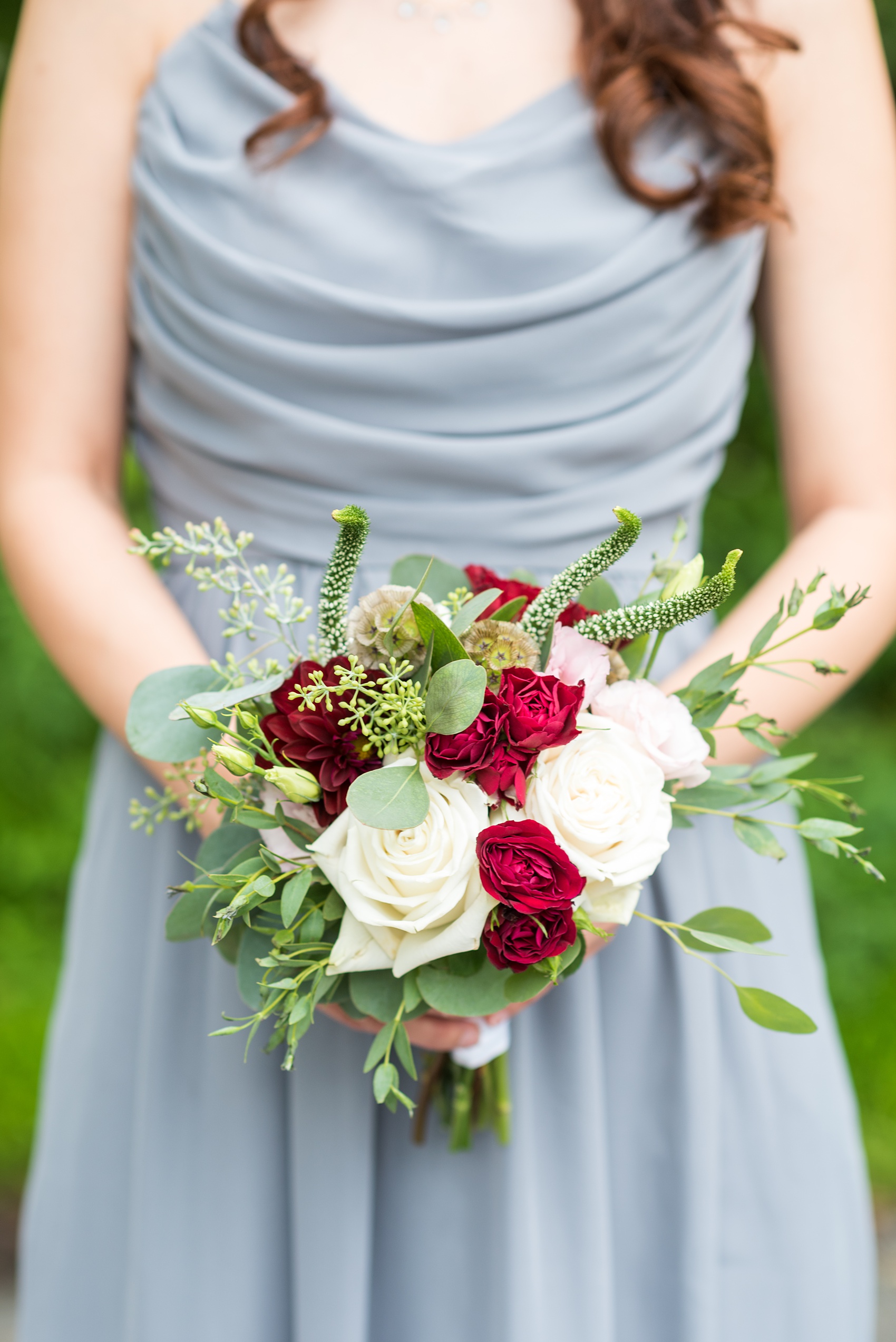 Wedding photos at Crabtree's Kittle House in Chappaqua, New York by Mikkel Paige Photography. This venue in Westchester county was a beautiful location to capture summer bridal party pictures, with the bridesmaids in grey gowns carrying red and white bouquets with roses and eucalyptus greenery. The historic home is very close to NYC. Click through for more wedding inspiration from their day! #mikkelpaige #CrabtreesKittleHouse #WestchesterWeddingVenues #WestchesterWedding #bridesmaidbouquet #summerwedding #weddingparty #bridalparty #greybridesmaidsdresses #greybridesmaidsgowns 