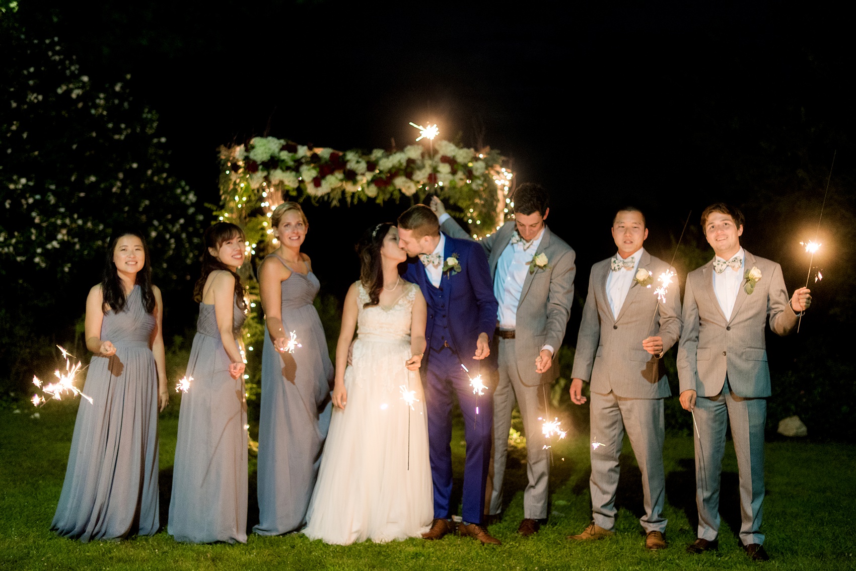 Wedding photos at Crabtree's Kittle House in Chappaqua, New York by Mikkel Paige Photography. The wedding party participated in night time photo sparkler fun at this historic Westchester County venue! Click through to see more from this summer wedding! #mikkelpaige #CrabtreesKittleHouse #WestchesterWeddingVenues #WestchesterWedding #summerwedding #sparklerphotos #weddingparty #nighttimeweddingphotos #nightweddingphotos #weddingpartysparklers