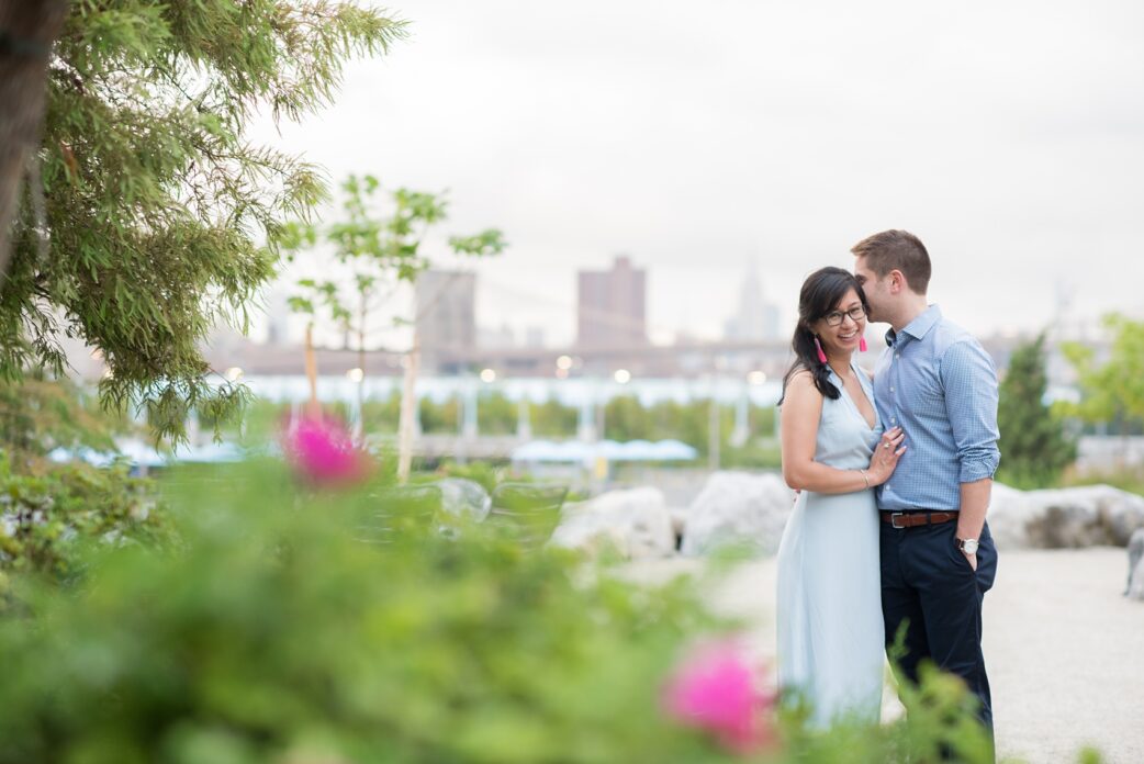 Brooklyn engagement photos by Mikkel Paige Photography. These beautiful, love-filled images in the park overlook bridges, the Manhattan skyline and waterfront on Piers 5 and 6. They'll provide inspiration from the bride and groom for outfits, romantic picture ideas and all around feel-good smiles! Click through to see their complete session post! #mikkelpaige #NYCweddingphotographer #NYCengagementsession #brooklynengagementphotos #engagementphotosinBrooklyn #BrooklynBridgePark #BrooklynPiers #ManhattanSkyline #BrooklynBridge #cityengagementphotos