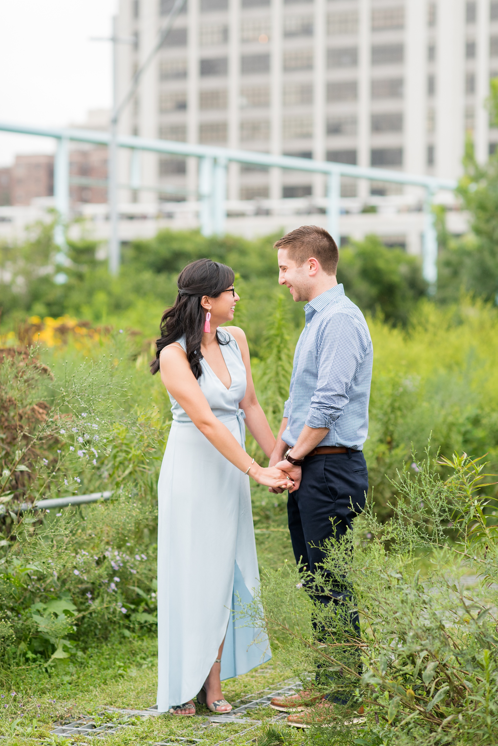 Brooklyn engagement photos by Mikkel Paige Photography. These beautiful, love-filled images in the park overlook bridges, the Manhattan skyline and waterfront on Piers 5 and 6. They'll provide inspiration from the bride and groom for outfits, romantic picture ideas and all around feel-good smiles! Click through to see their complete session post! #mikkelpaige #NYCweddingphotographer #NYCengagementsession #brooklynengagementphotos #engagementphotosinBrooklyn #BrooklynBridgePark #BrooklynPiers #ManhattanSkyline #BrooklynBridge #cityengagementphotos