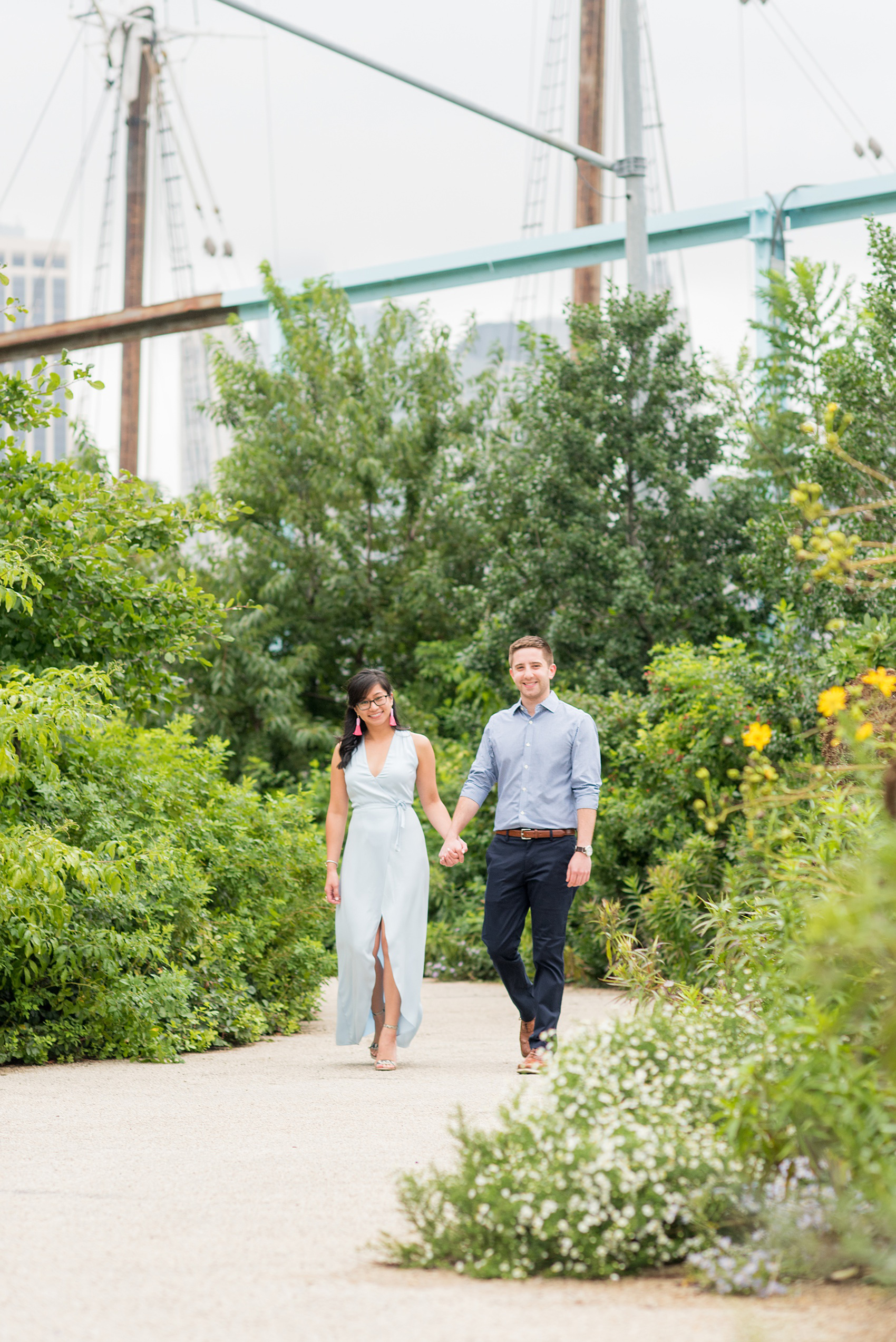 Brooklyn engagement photos by Mikkel Paige Photography. These beautiful, love-filled images in the park overlook bridges, the Manhattan skyline and waterfront on Piers 5 and 6. They'll provide inspiration from the bride and groom for outfits, romantic picture ideas and all around feel-good smiles! Click through to see their complete session post! #mikkelpaige #NYCweddingphotographer #NYCengagementsession #brooklynengagementphotos #engagementphotosinBrooklyn #BrooklynBridgePark #BrooklynPiers #ManhattanSkyline #BrooklynBridge #cityengagementphotos