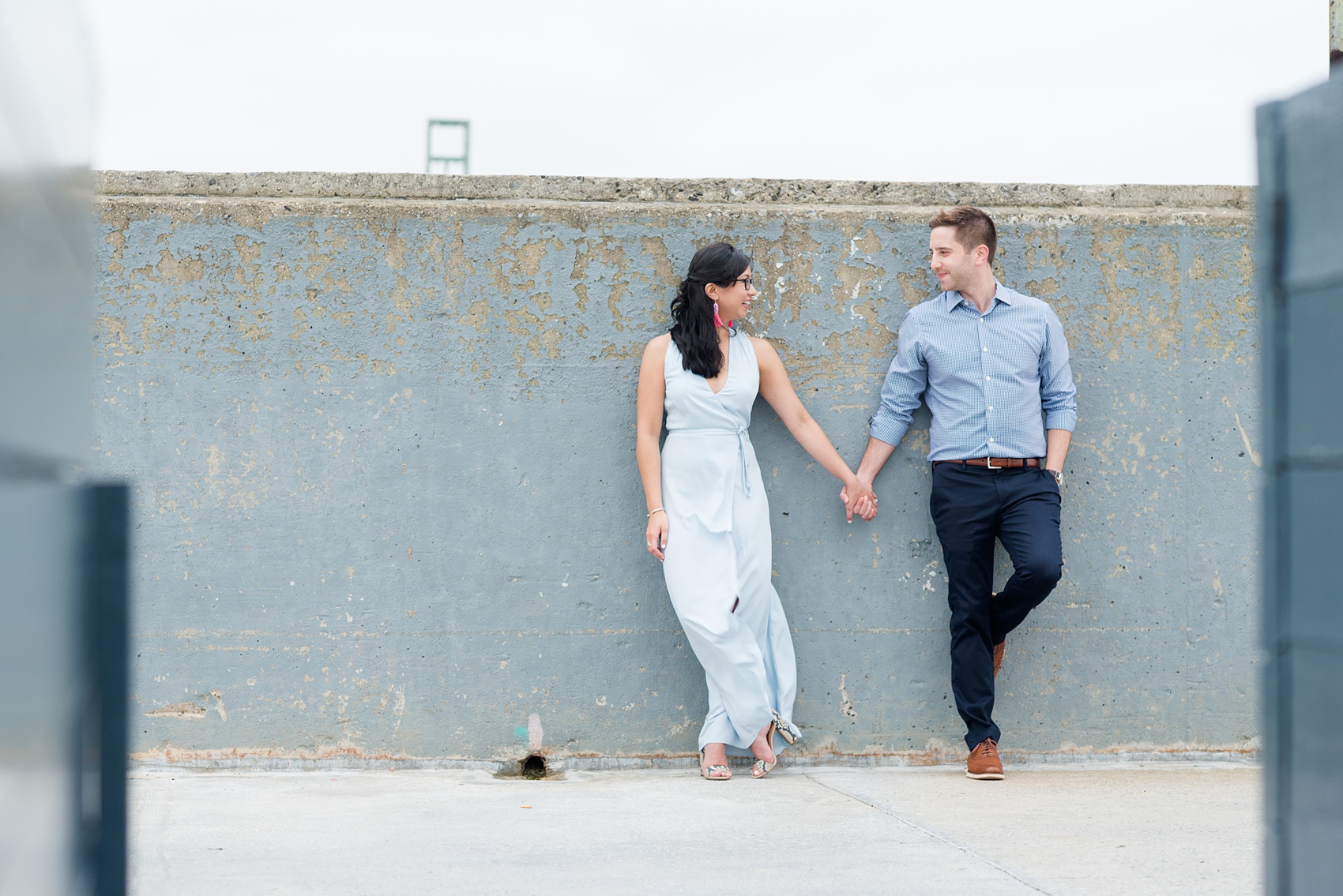 Brooklyn engagement photos by Mikkel Paige Photography. These beautiful, love-filled images in the park overlook bridges, the Manhattan skyline and waterfront on Piers 5 and 6. They'll provide inspiration from the bride and groom for outfits, romantic picture ideas and all around feel-good smiles! Click through to see their complete session post! #mikkelpaige #NYCweddingphotographer #NYCengagementsession #brooklynengagementphotos #engagementphotosinBrooklyn #BrooklynBridgePark #BrooklynPiers #ManhattanSkyline #BrooklynBridge #cityengagementphotos