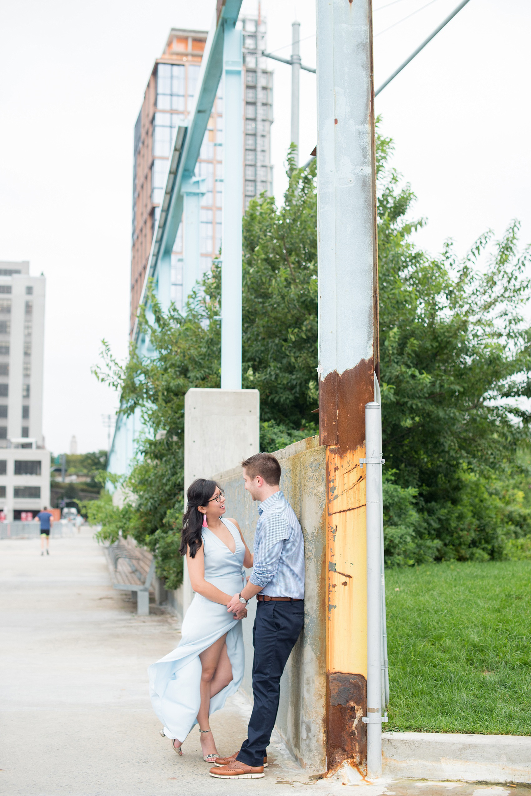 Brooklyn engagement photos by Mikkel Paige Photography. These beautiful, love-filled images in the park overlook bridges, the Manhattan skyline and waterfront on Piers 5 and 6. They'll provide inspiration from the bride and groom for outfits, romantic picture ideas and all around feel-good smiles! Click through to see their complete session post! #mikkelpaige #NYCweddingphotographer #NYCengagementsession #brooklynengagementphotos #engagementphotosinBrooklyn #BrooklynBridgePark #BrooklynPiers #ManhattanSkyline #BrooklynBridge #cityengagementphotos