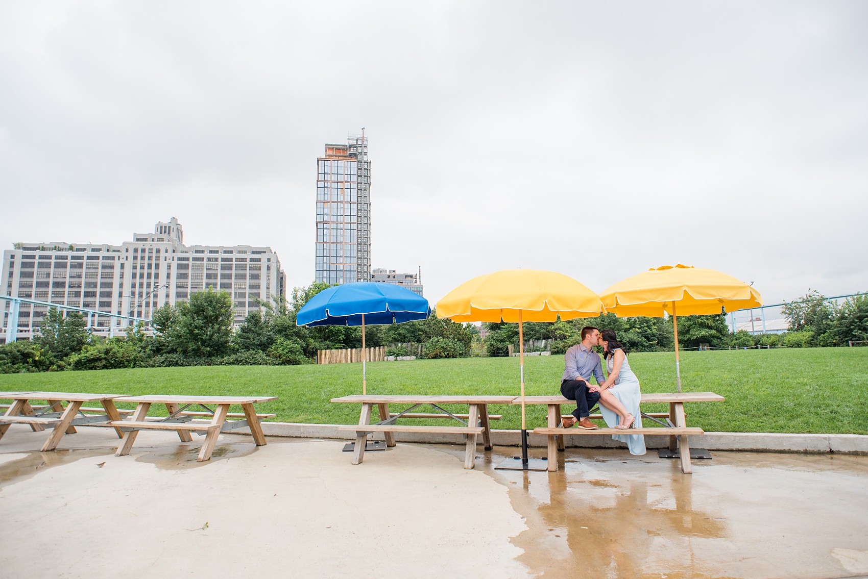 Brooklyn engagement photos by Mikkel Paige Photography. These beautiful, love-filled images in the park overlook bridges, the Manhattan skyline and waterfront on Piers 5 and 6. They'll provide inspiration from the bride and groom for outfits, romantic picture ideas and all around feel-good smiles! Click through to see their complete session post! #mikkelpaige #NYCweddingphotographer #NYCengagementsession #brooklynengagementphotos #engagementphotosinBrooklyn #BrooklynBridgePark #BrooklynPiers #ManhattanSkyline #BrooklynBridge #cityengagementphotos