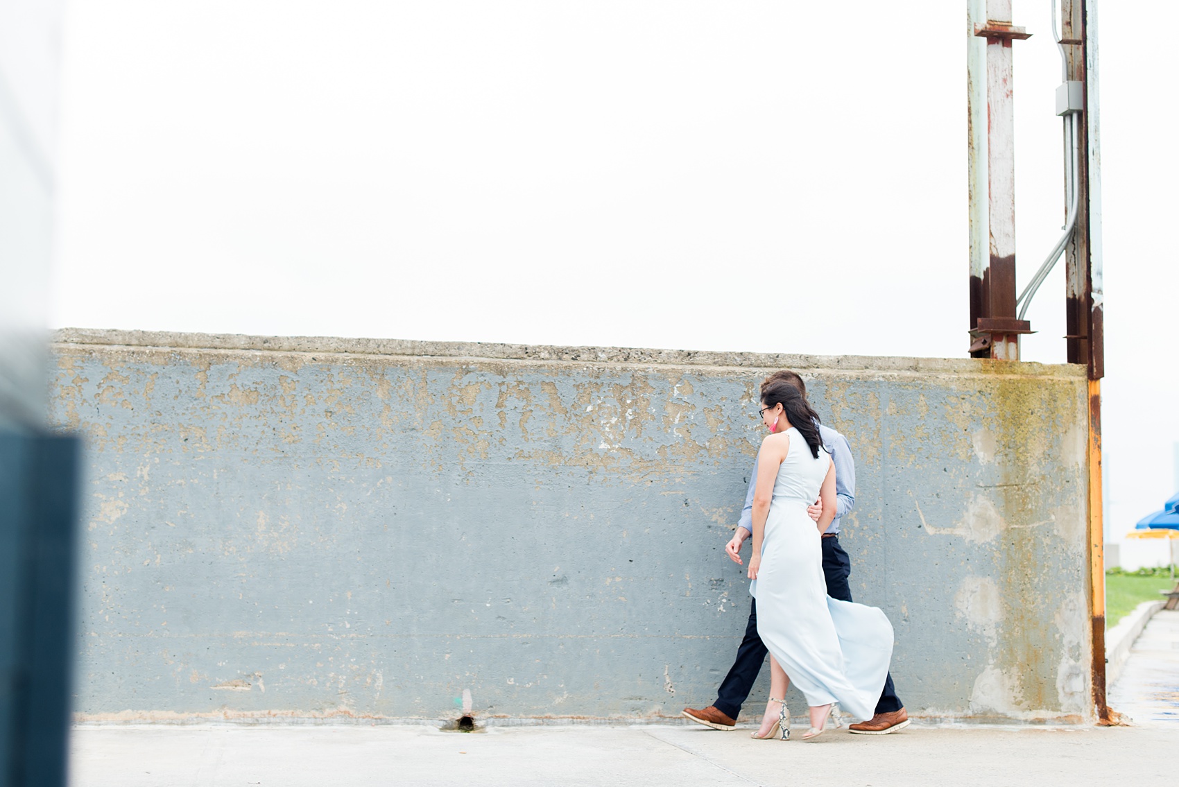 Brooklyn engagement photos by Mikkel Paige Photography. These beautiful, love-filled images in the park overlook bridges, the Manhattan skyline and waterfront on Piers 5 and 6. They'll provide inspiration from the bride and groom for outfits, romantic picture ideas and all around feel-good smiles! Click through to see their complete session post! #mikkelpaige #NYCweddingphotographer #NYCengagementsession #brooklynengagementphotos #engagementphotosinBrooklyn #BrooklynBridgePark #BrooklynPiers #ManhattanSkyline #BrooklynBridge #cityengagementphotos 