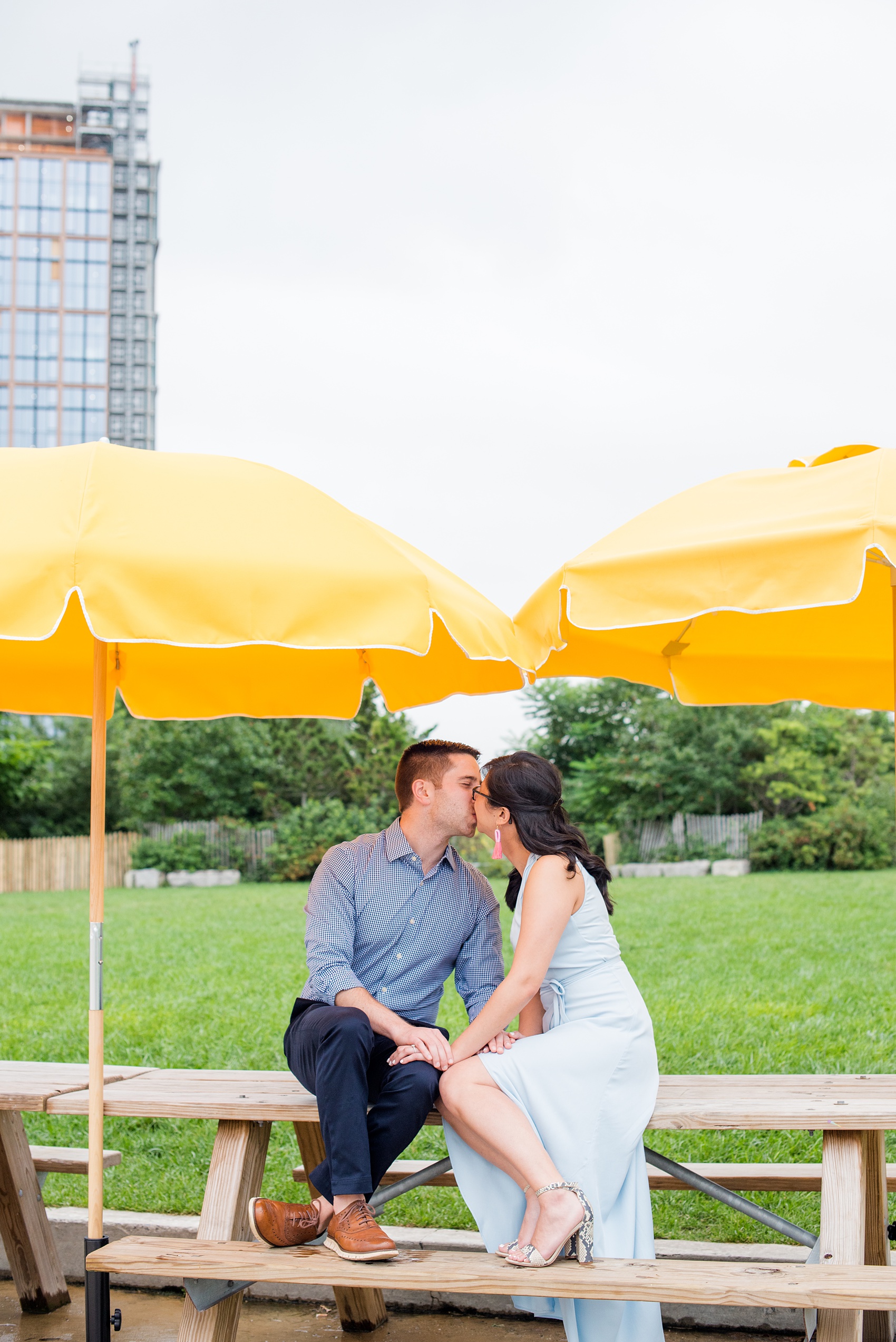 Brooklyn engagement photos by Mikkel Paige Photography. These beautiful, love-filled images in the park overlook bridges, the Manhattan skyline and waterfront on Piers 5 and 6. They'll provide inspiration from the bride and groom for outfits, romantic picture ideas and all around feel-good smiles! Click through to see their complete session post! #mikkelpaige #NYCweddingphotographer #NYCengagementsession #brooklynengagementphotos #engagementphotosinBrooklyn #BrooklynBridgePark #BrooklynPiers #ManhattanSkyline #BrooklynBridge #cityengagementphotos