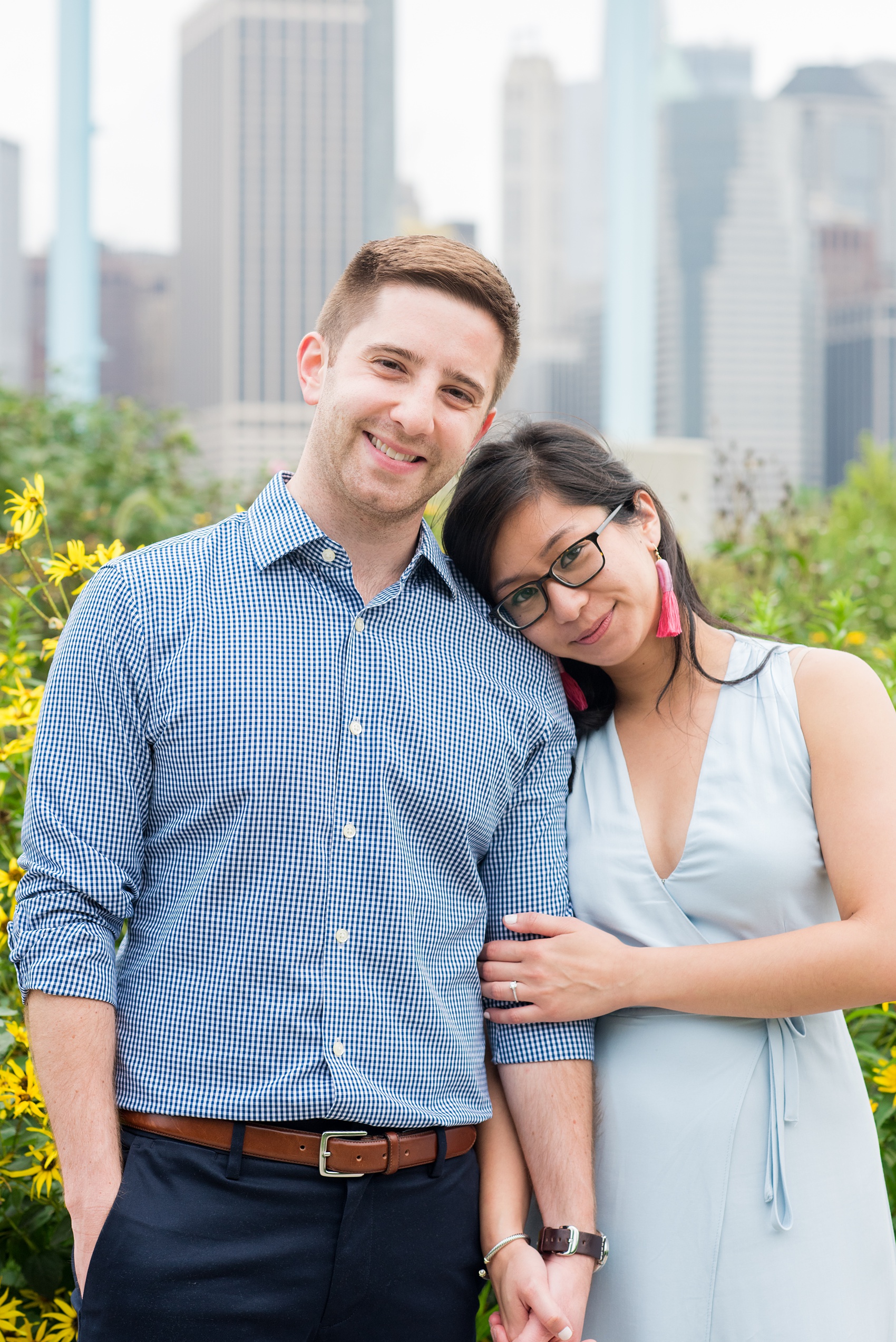 Brooklyn engagement photos by Mikkel Paige Photography. These beautiful, love-filled images in the park overlook bridges, the Manhattan skyline and waterfront on Piers 5 and 6. They'll provide inspiration from the bride and groom for outfits, romantic picture ideas and all around feel-good smiles! Click through to see their complete session post! #mikkelpaige #NYCweddingphotographer #NYCengagementsession #brooklynengagementphotos #engagementphotosinBrooklyn #BrooklynBridgePark #BrooklynPiers #ManhattanSkyline #BrooklynBridge #cityengagementphotos