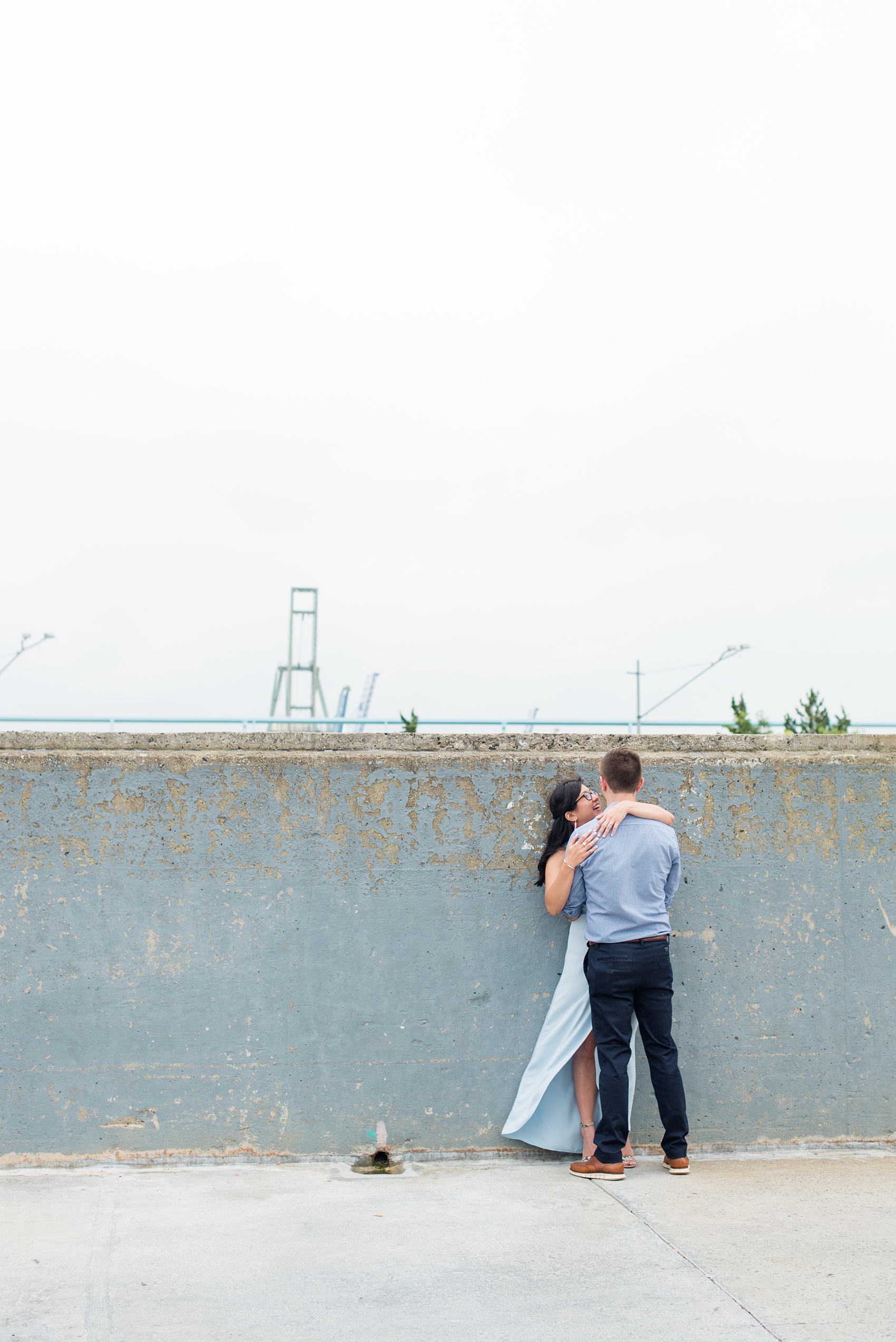 Brooklyn engagement photos by Mikkel Paige Photography. These beautiful, love-filled images in the park overlook bridges, the Manhattan skyline and waterfront on Piers 5 and 6. They'll provide inspiration from the bride and groom for outfits, romantic picture ideas and all around feel-good smiles! Click through to see their complete session post! #mikkelpaige #NYCweddingphotographer #NYCengagementsession #brooklynengagementphotos #engagementphotosinBrooklyn #BrooklynBridgePark #BrooklynPiers #ManhattanSkyline #BrooklynBridge #cityengagementphotos