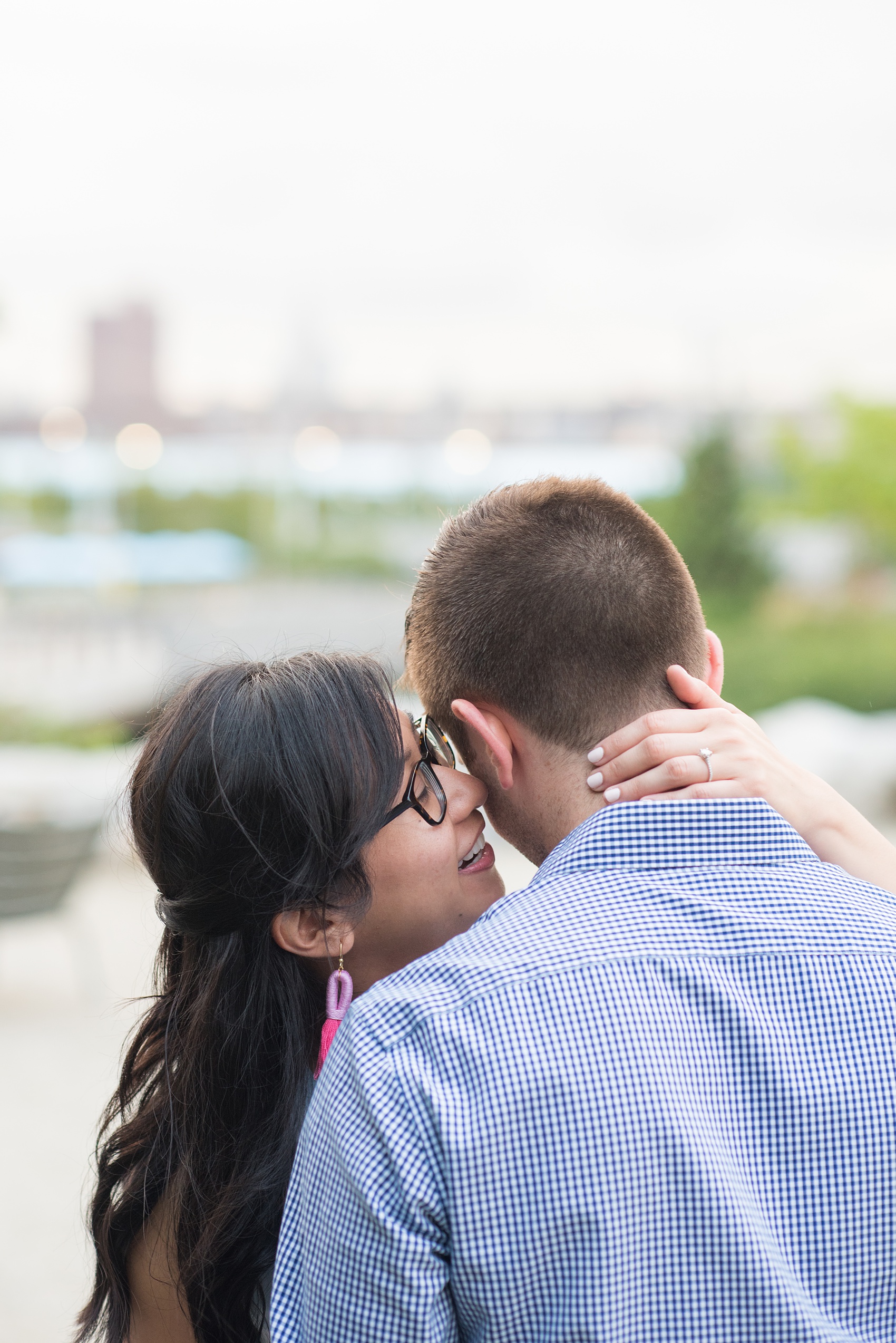 Brooklyn engagement photos by Mikkel Paige Photography. These beautiful, love-filled images in the park overlook bridges, the Manhattan skyline and waterfront on Piers 5 and 6. They'll provide inspiration from the bride and groom for outfits, romantic picture ideas and all around feel-good smiles! Click through to see their complete session post! #mikkelpaige #NYCweddingphotographer #NYCengagementsession #brooklynengagementphotos #engagementphotosinBrooklyn #BrooklynBridgePark #BrooklynPiers #ManhattanSkyline #BrooklynBridge #cityengagementphotos