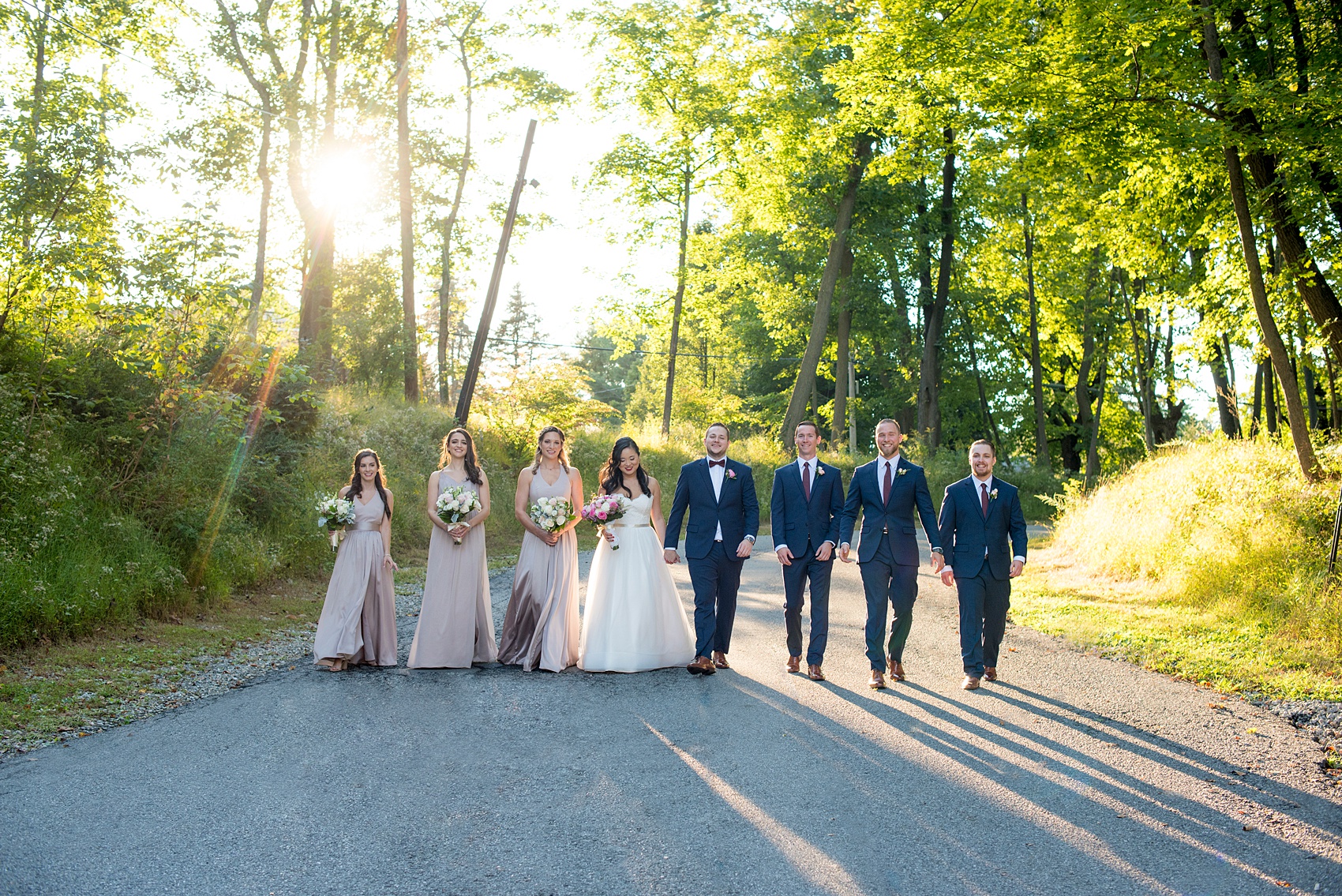 Wedding photos at Crabtree's Kittle House in Chappaqua, New York by Mikkel Paige Photography. This venue in Westchester county is the perfect place for a September wedding. Golden hour shone down on the bridal party in dusty rose gowns and groomsmen in navy blue suits. Click through for more wedding photos from the day! #navybluesuit #mikkelpaige #CrabtreesKittleHouse #WestchesterWeddingVenues #WestchesterWedding #Septemberwedding #weddingparty #BridalParty #goldenhour #dustyrose 