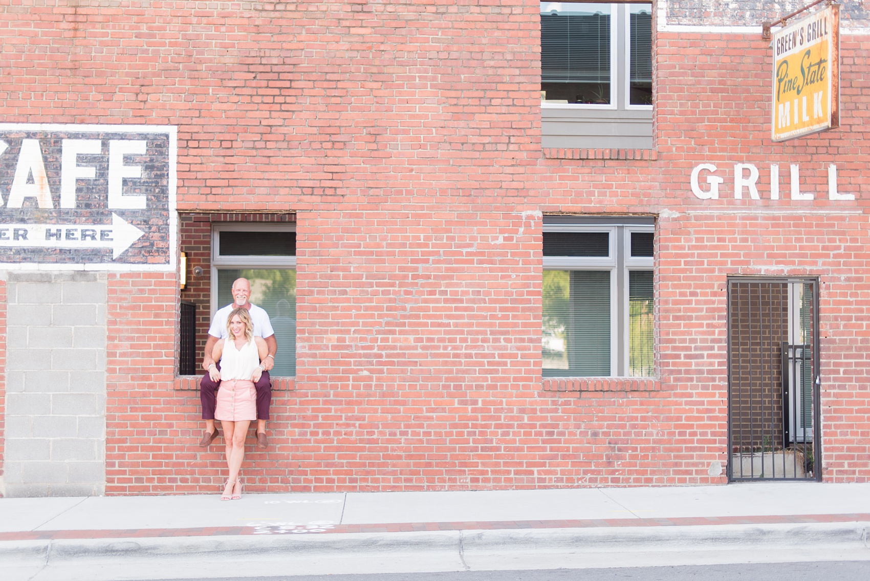 Urban engagement photos in downtown Durham, North Carolina, by Mikkel Paige Photography. #DurhamWeddingPhotographer #RaleighWeddingPhotographer #DurhamEngagementPhotos #urbanengagementphotos #cityengagementsession #cityengagementphotos