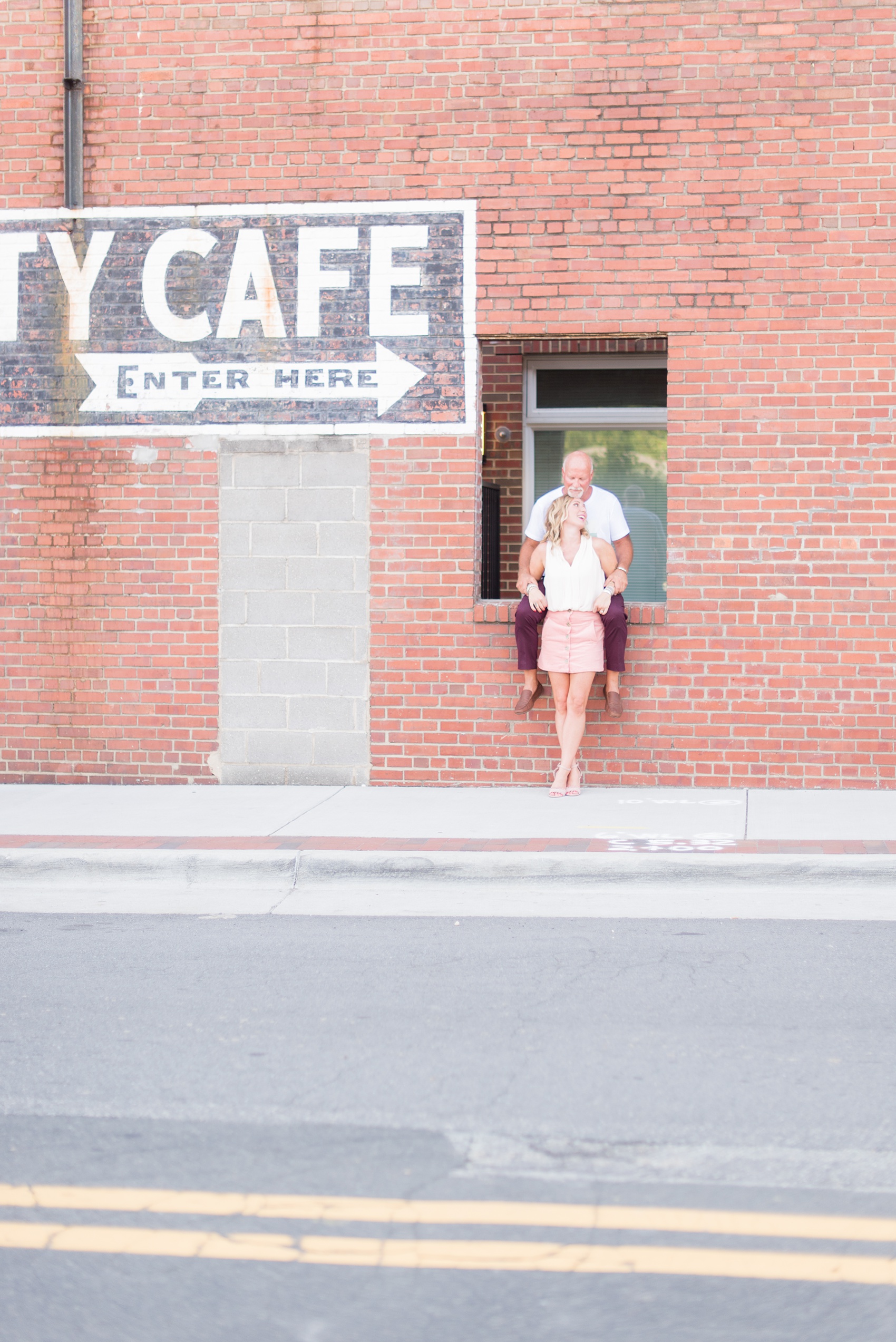 Urban engagement photos in downtown Durham, North Carolina, by Mikkel Paige Photography. #DurhamWeddingPhotographer #RaleighWeddingPhotographer #DurhamEngagementPhotos #urbanengagementphotos #cityengagementsession #cityengagementphotos