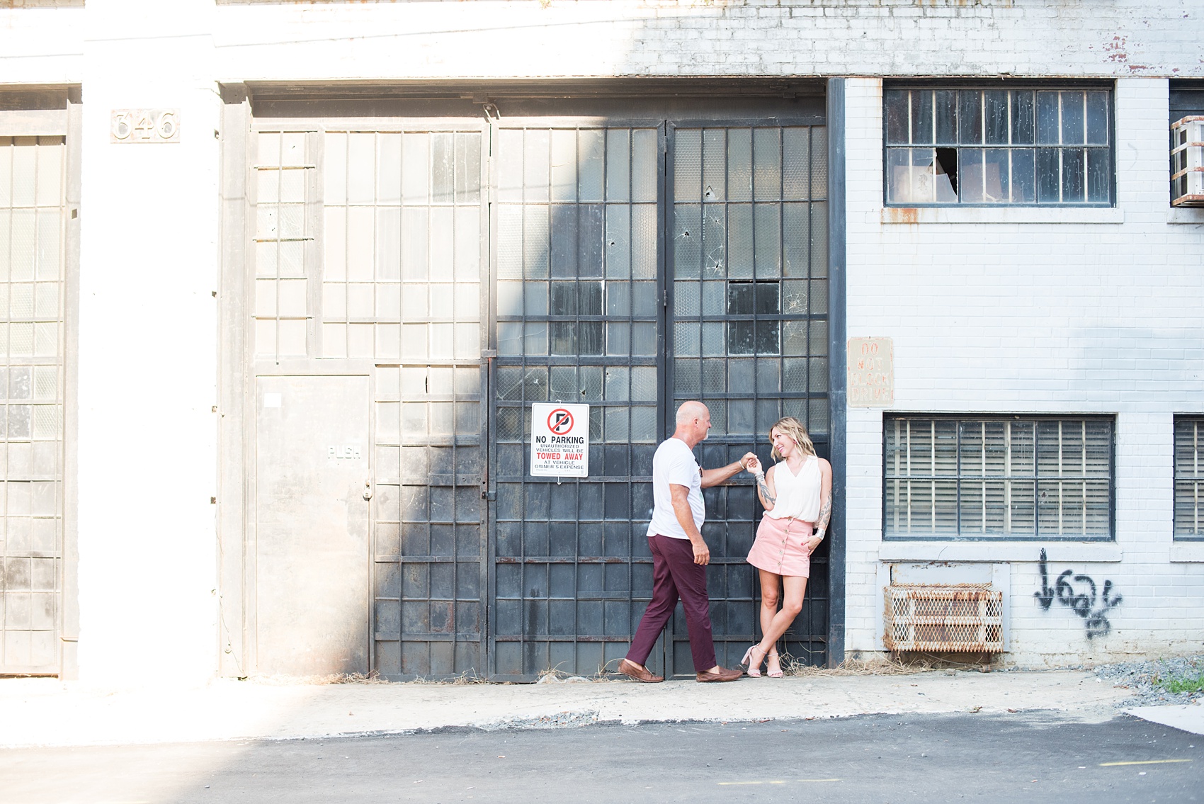 Urban engagement photos in downtown Durham, North Carolina, by Mikkel Paige Photography. #DurhamWeddingPhotographer #RaleighWeddingPhotographer #DurhamEngagementPhotos #urbanengagementphotos #cityengagementsession #cityengagementphotos