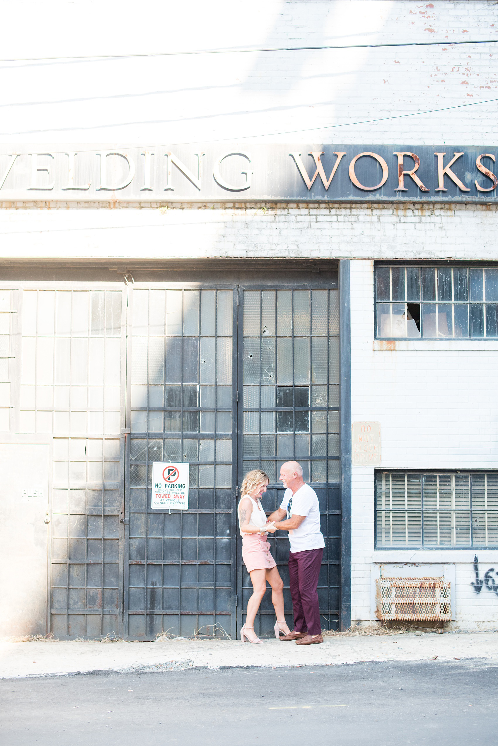 Urban engagement photos in downtown Durham, North Carolina, by Mikkel Paige Photography. #DurhamWeddingPhotographer #RaleighWeddingPhotographer #DurhamEngagementPhotos #urbanengagementphotos #cityengagementsession #cityengagementphotos