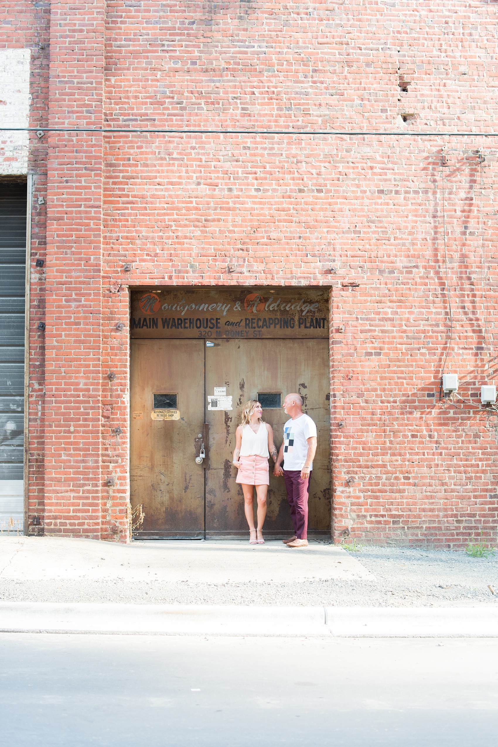 Urban engagement photos in downtown Durham, North Carolina, by Mikkel Paige Photography. #DurhamWeddingPhotographer #RaleighWeddingPhotographer #DurhamEngagementPhotos #urbanengagementphotos #cityengagementsession #cityengagementphotos