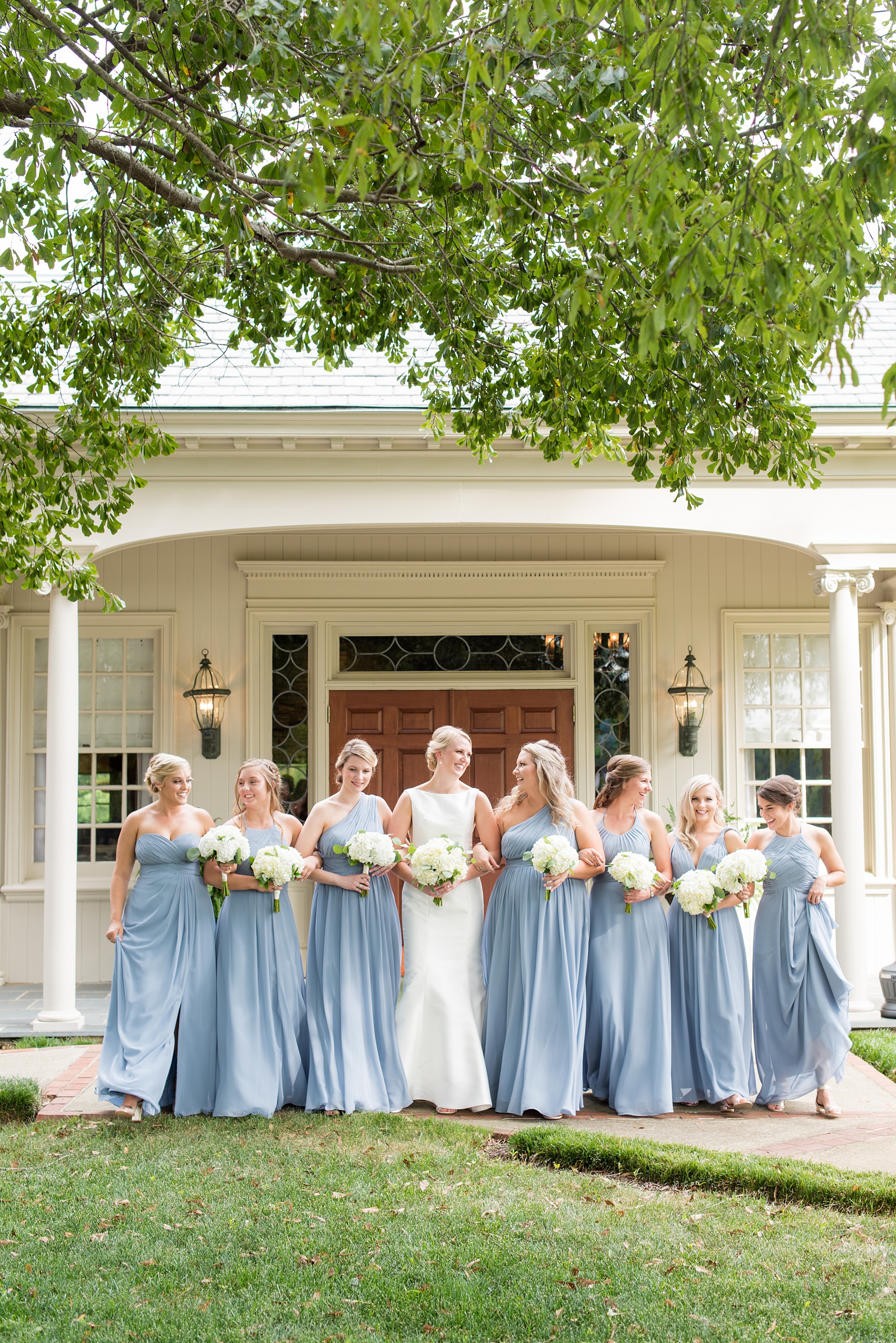 Pictures by Durham wedding photographer, Mikkel Paige Photography, in North Carolina. The beautiful white flowers from the days events, pretty garden-like golf course at Croasdaile Country Club and various photo ideas with the bridesmaids in blue and bride in a low-back gown will inspire you! Click through to our website for the complete post and details. #durhamNC #northcarolinawedding #southernwedding #golfcoursewedding #CountryClubWedding #bluebridesmaids #DurhamWedding #summerwedding