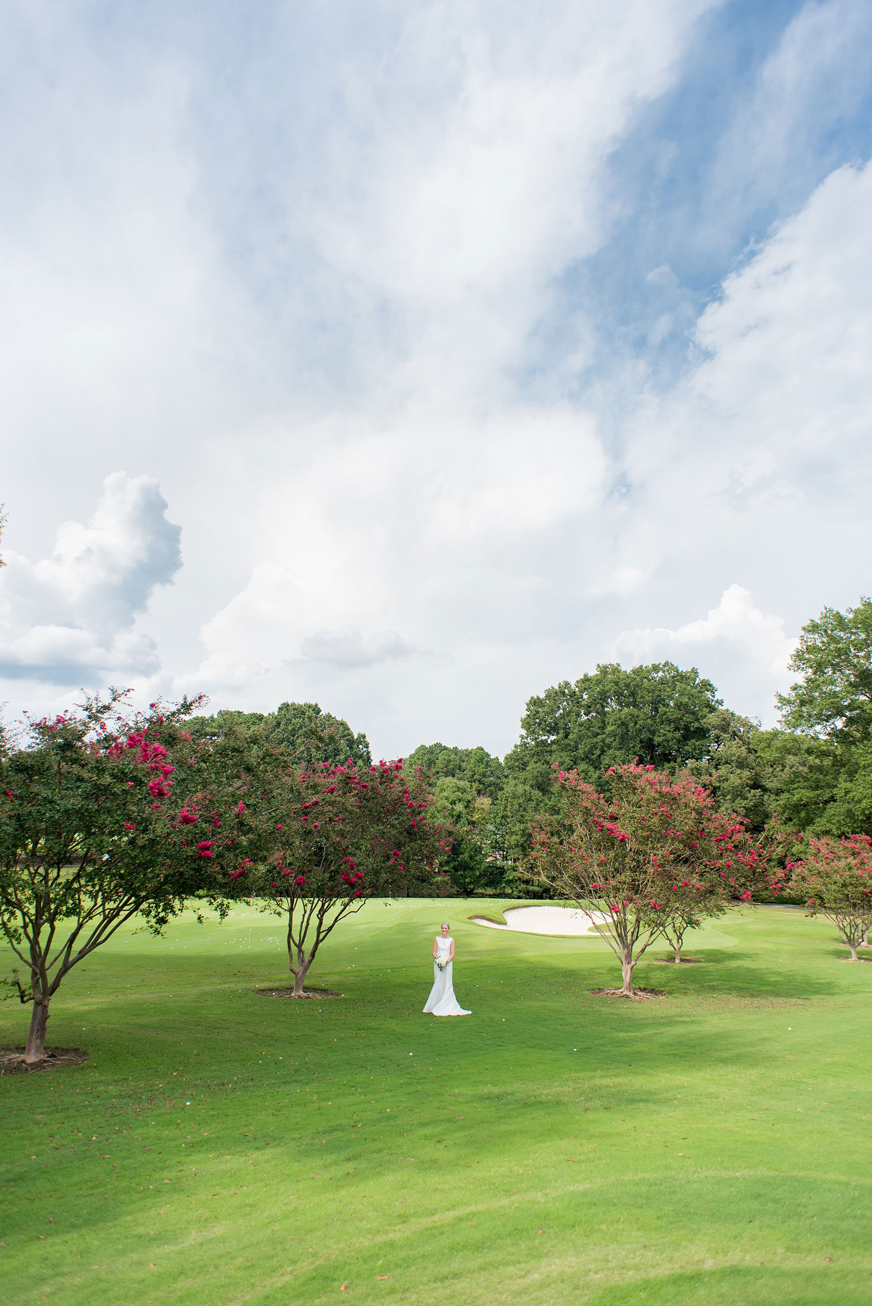 Pictures by Mikkel Paige Photography of a wedding in Durham, North Carolina. The beautiful white hydrangea flowers from the day’s events, pretty garden-like golf course and various photo ideas with the bridal party, bride and groom will provide endless inspiration! Click through to our website for the complete post and details. #durhamNC #northcarolinawedding #southernwedding #golfcoursewedding #CountryClubWedding #bluebridesmaids #DurhamWedding #summerwedding