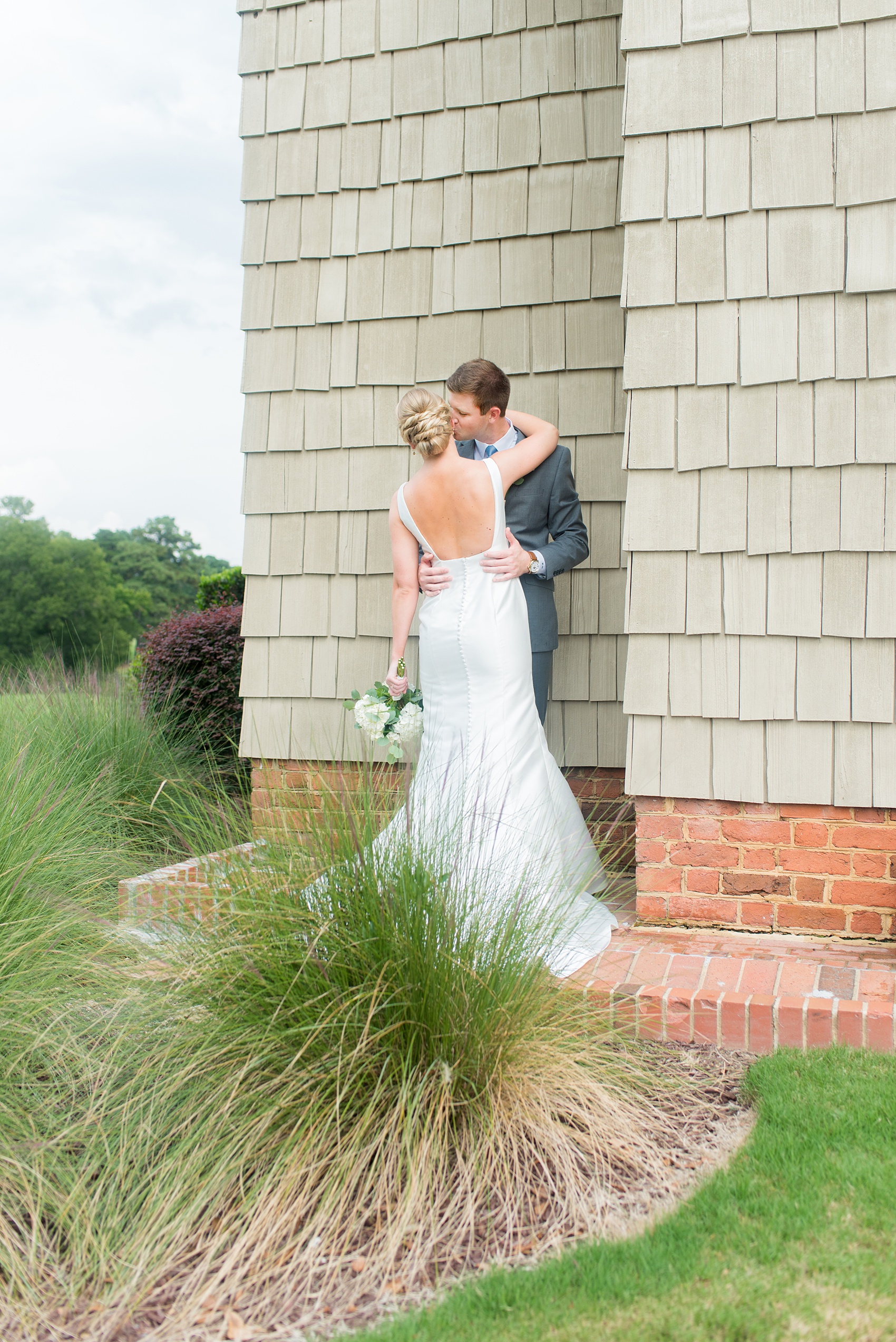 Pictures by Mikkel Paige Photography of a wedding in Durham, North Carolina. The beautiful white hydrangea flowers from the day’s events, pretty garden-like golf course and various photo ideas with the bridal party, bride and groom will provide endless inspiration! Click through to our website for the complete post and details. #durhamNC #northcarolinawedding #southernwedding #golfcoursewedding #CountryClubWedding #bluebridesmaids #DurhamWedding #summerwedding