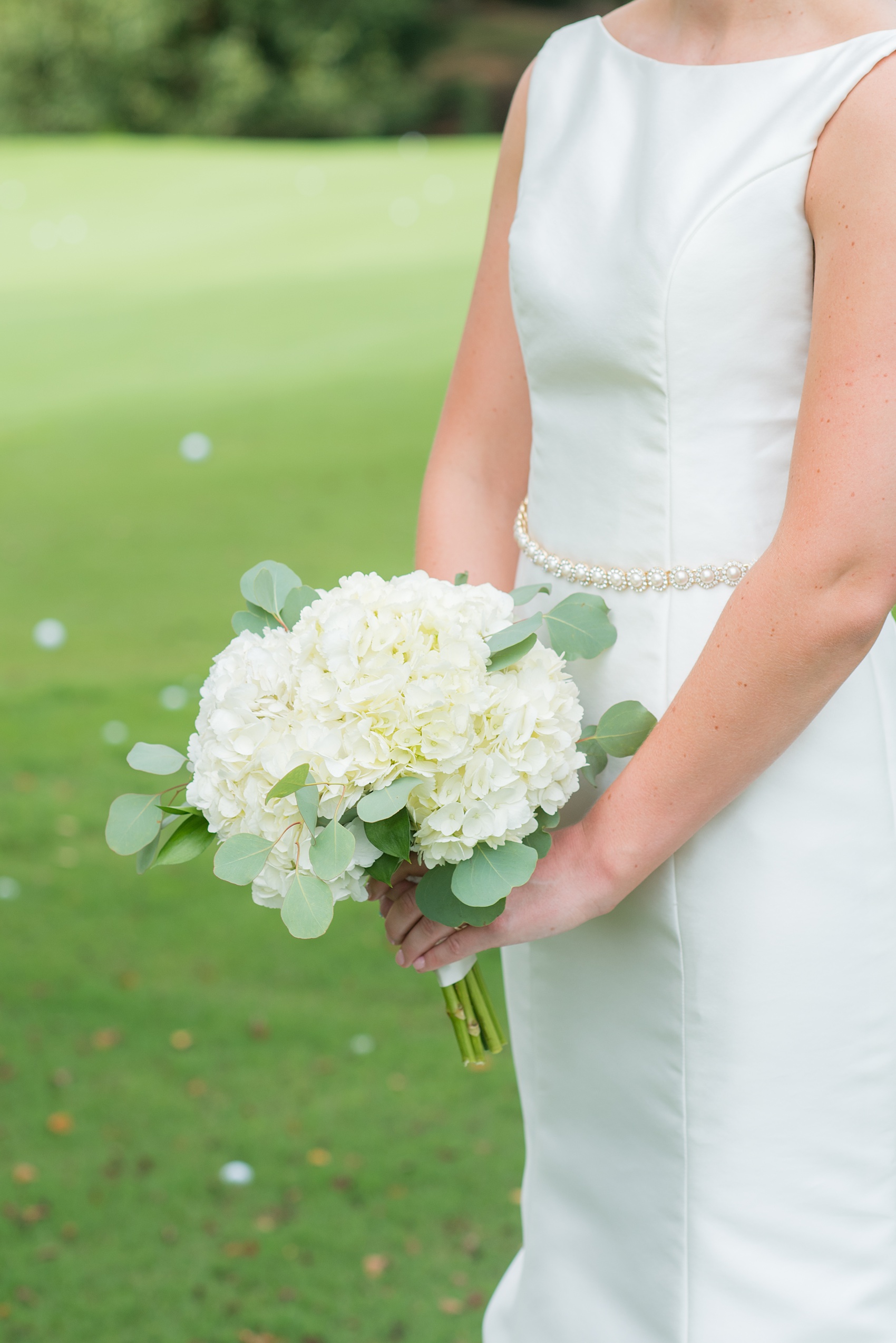 Pictures by Mikkel Paige Photography of a wedding in Durham, North Carolina. The beautiful white hydrangea flowers from the days events, pretty garden-like golf course at Croasdaile Country Club and various photo ideas with the bridesmaids, bride and groom, and groomsmen will provide endless inspiration! Click through to our website for the complete post and details. #durhamNC #northcarolinawedding #southernwedding #golfcoursewedding #CountryClubWedding #bluebridesmaids #DurhamWedding #summerwedding