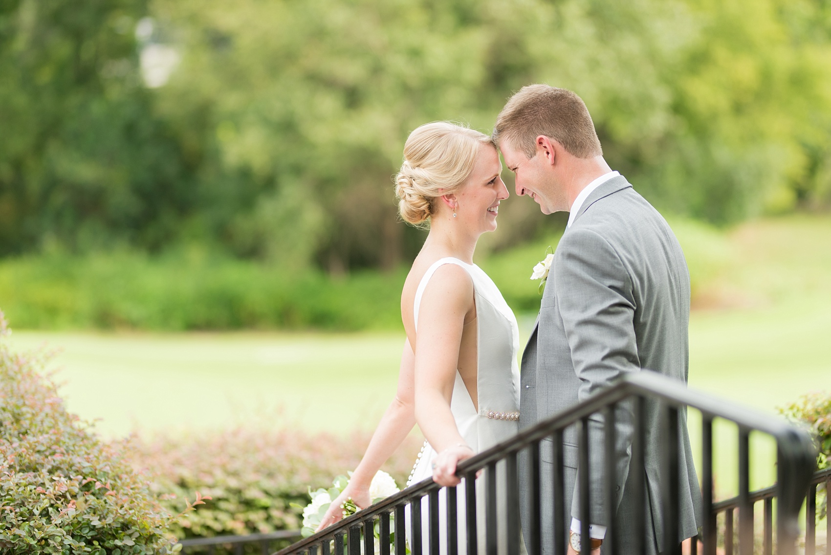 Pictures by Mikkel Paige Photography of a wedding in Durham, North Carolina. The beautiful white flowers from the days events, pretty garden-like golf course at Croasdaile Country Club and various photo ideas with the bridesmaids, bride and groom, and groomsmen will provide endless inspiration! Click through to our website for the complete post and details. #durhamNC #northcarolinawedding #southernwedding #golfcoursewedding #CountryClubWedding #bluebridesmaids #DurhamWedding #summerwedding