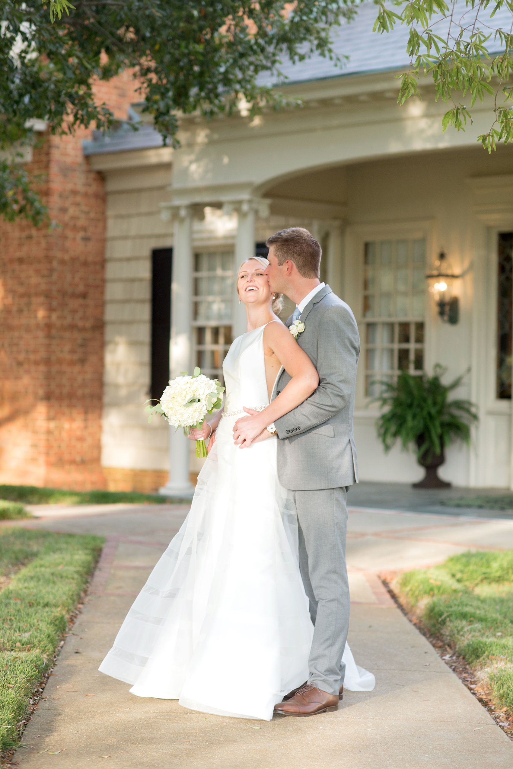 Pictures by Mikkel Paige Photography of a wedding in Durham, North Carolina. The beautiful white flowers from the days events, pretty garden-like golf course at Croasdaile Country Club and various photo ideas with the bridesmaids, bride and groom, and groomsmen will provide endless inspiration! Click through to our website for the complete post and details. #durhamNC #northcarolinawedding #southernwedding #golfcoursewedding #CountryClubWedding #bluebridesmaids #DurhamWedding #summerwedding