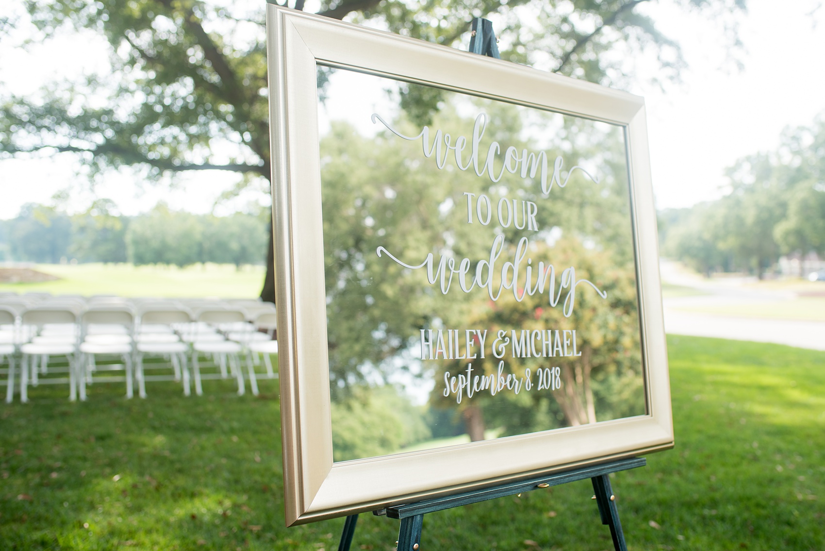 Pictures by Mikkel Paige Photography of a wedding in Durham, North Carolina. The bride and groom stood under a simple arch during their outdoor ceremony at Croasdaile Country Club, a golf-course venue with beautiful gardens.Click through to our website for endless ideas and the complete post! #durhamNC #northcarolinawedding #southernwedding #golfcoursewedding #CountryClubWedding #bluebridesmaids #DurhamWedding #summerwedding #southernwedding #outdoorceremony