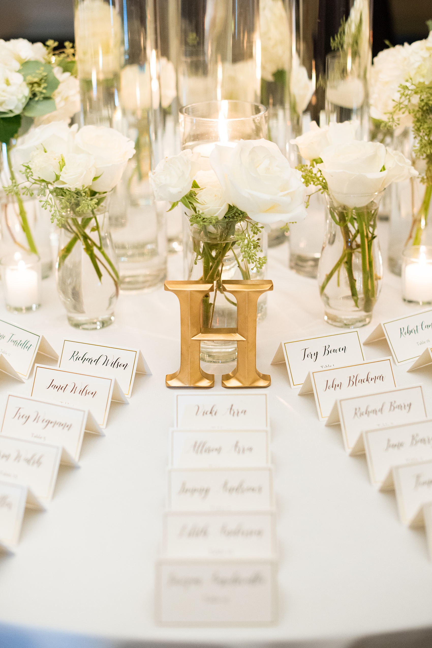 Pictures by Mikkel Paige Photography of a wedding in Durham, North Carolina. Beautiful hydrangea flowers adorned the reception area that overlooked a pretty garden-like golf course. Guests found their seats with classic black and white escort cards that matched the couple’s invitation stationery. Click through to our website for the complete post! #durhamNC #northcarolinawedding #golfcoursewedding #CountryClub #DurhamWedding #summerwedding #escortcardtable #placecards #EscortCards