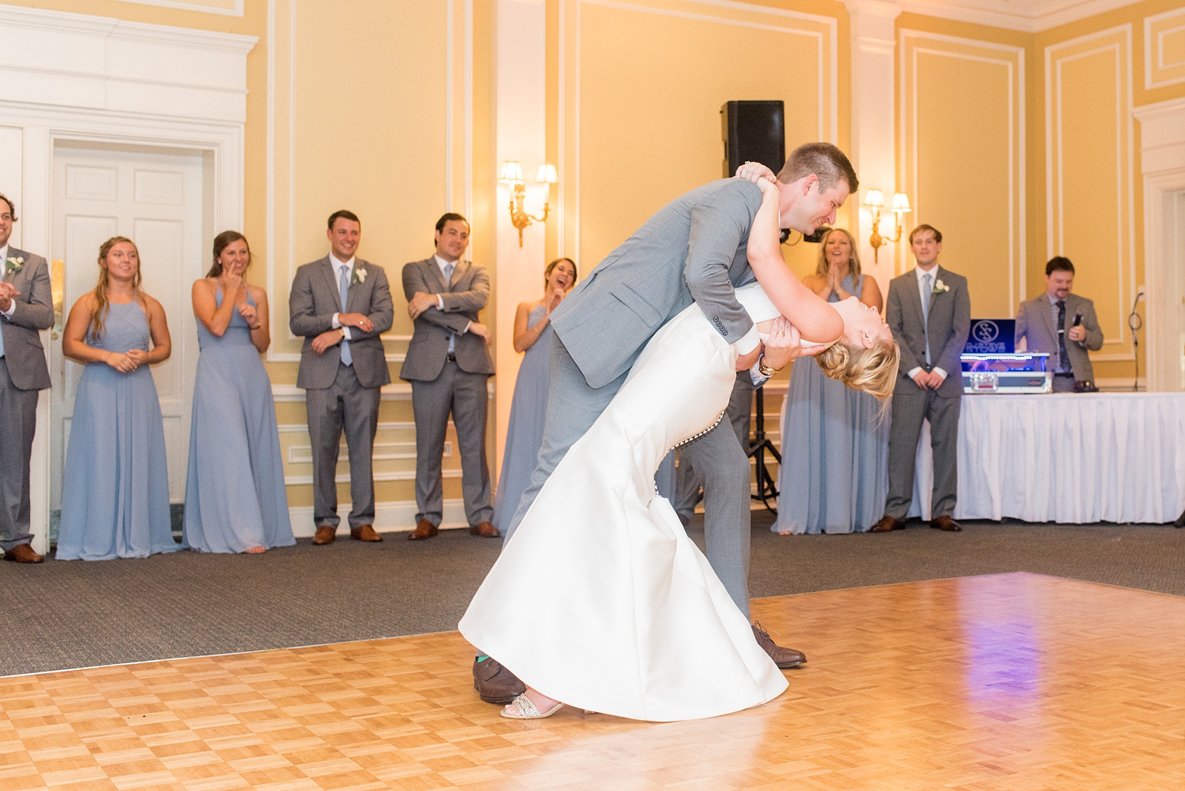 Pictures by Mikkel Paige Photography of a wedding in Durham, North Carolina. The beautiful hydrangea flowers from the day’s events adorned the party room that overlooked a pretty garden-like golf course. The bride and groom’s special first dance was choreographed with dips and lifts! Click through to our website for the complete post! #durhamNC #northcarolinawedding #golfcoursewedding #CountryClub #DurhamWedding #summerwedding #glowsticks #firstdance #choreographeddance #brideandgroom