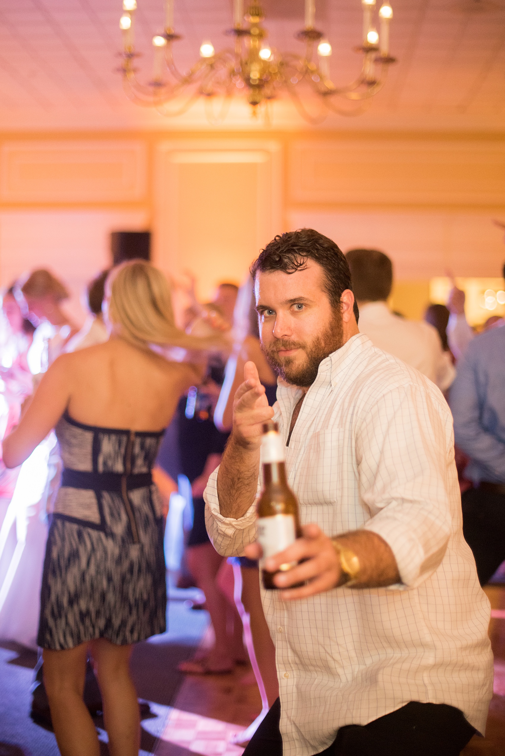 Pictures by Mikkel Paige Photography of a wedding in Durham, North Carolina. The beautiful white hydrangea flowers from the day’s events adorned a reception with cocktail hour overlooking a pretty garden-like golf course. The DJ played tunes everyone danced the night away to before a glowstick exit. Click through to our website for the complete post and details! #durhamNC #northcarolinawedding #golfcoursewedding #CountryClubWedding #DurhamWedding #summerwedding #weddingexit #glowstickexit