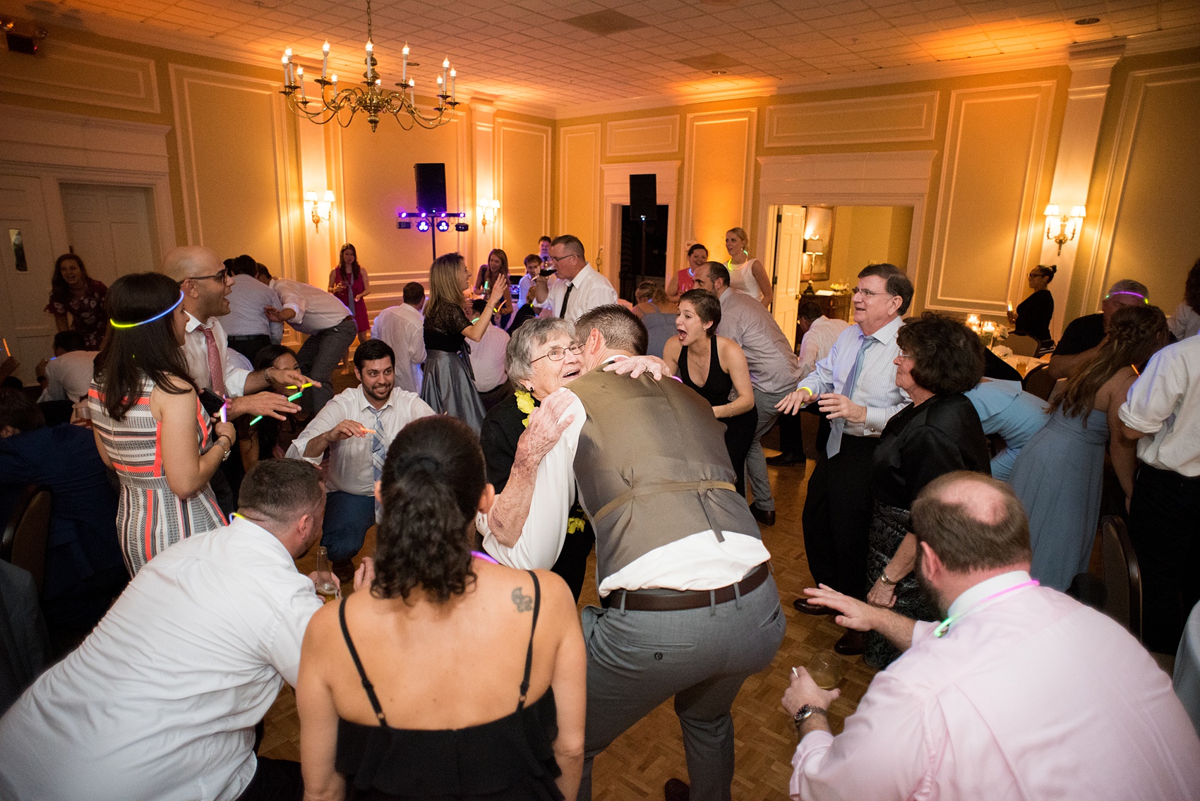 Pictures by Mikkel Paige Photography of a wedding in Durham, North Carolina. The beautiful white hydrangea flowers from the day’s events adorned a reception with cocktail hour overlooking a pretty garden-like golf course. The DJ played tunes everyone danced the night away to before a glowstick exit. Click through to our website for the complete post and details! #durhamNC #northcarolinawedding #golfcoursewedding #CountryClubWedding #DurhamWedding #summerwedding #weddingexit #glowstickexit