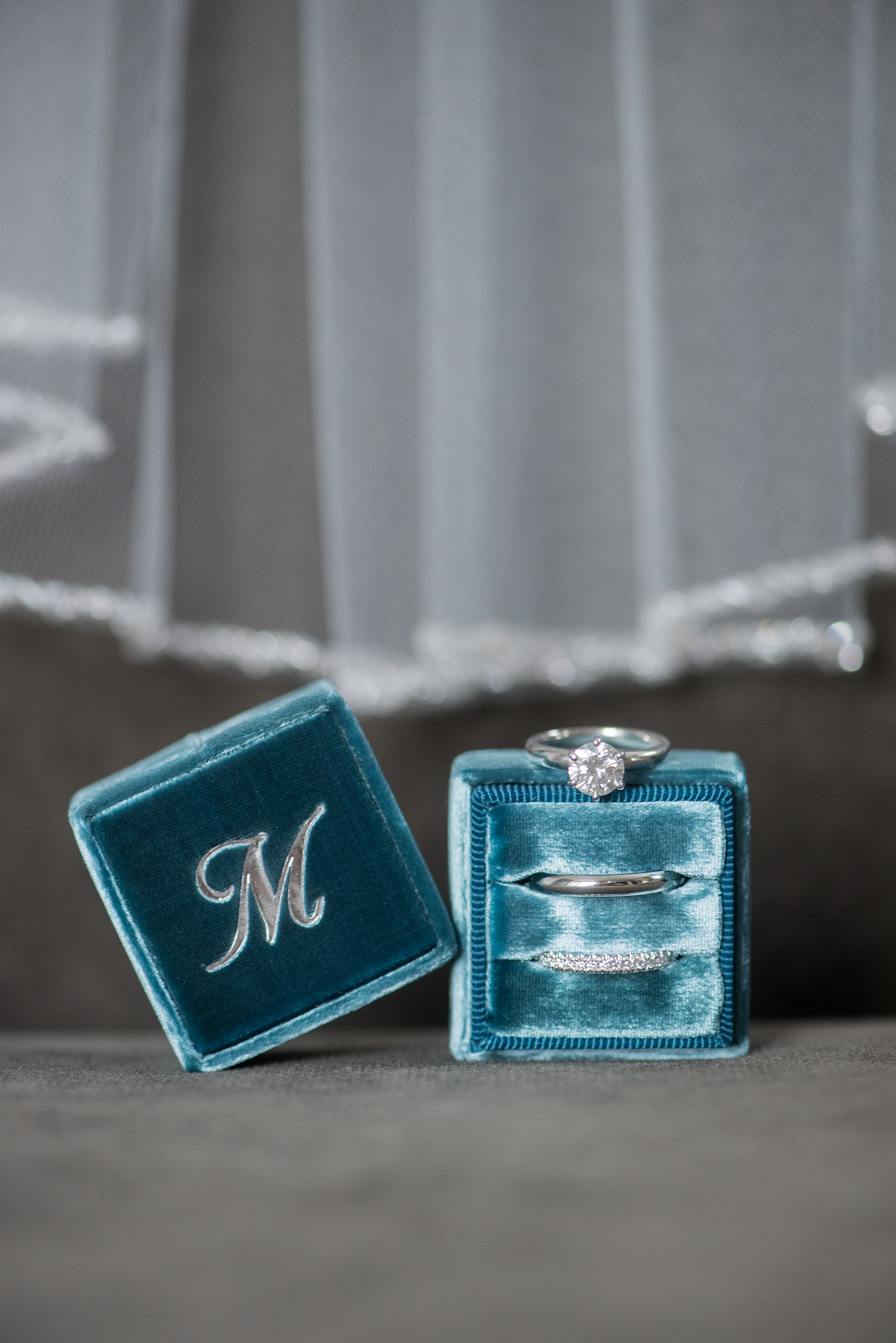 Wedding photos at Tribeca Rooftop by Mikkel Paige Photography, in NYC. This Manhattan venue has the perfect view of the New York City skyline including Freedom Tower. The bride bought a teal velvet Mrs. Box, ring box, for their jewelry. #ManhattanWedding #TribecaRooftop #TribecaRooftopWeddingPhotos #SeptemberWedding #MikkelPaige #WeddingPhotos #MrsBox #TealWedding #Rings #WeddingRings #weddingdetails