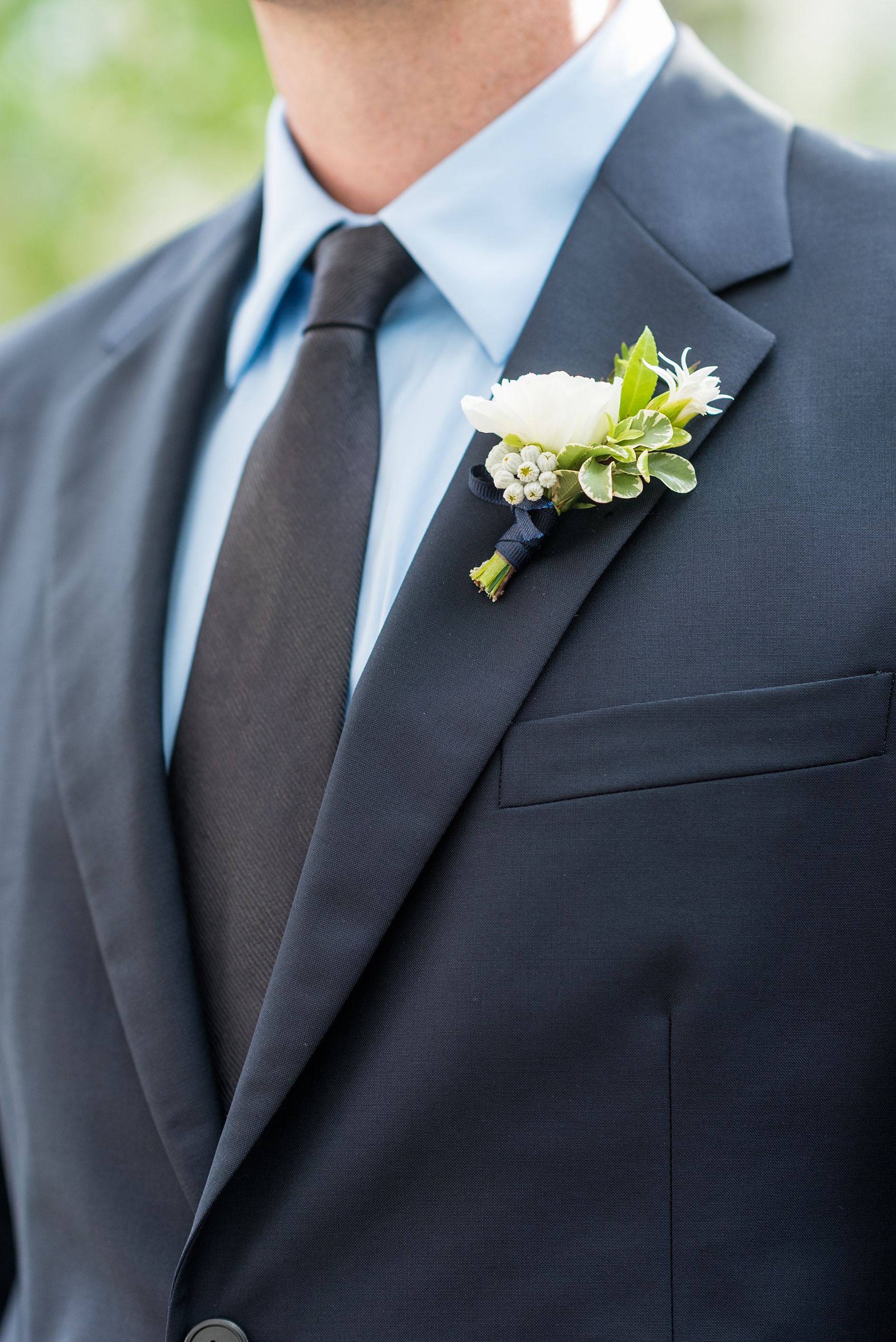 Prospect Park Boathouse wedding photos in Brooklyn, New York by Mikkel Paige Photography. Photos include gay wedding decor inspiration and details like white ranunculus boutonnieres with navy blue ribbon. This city ceremony was performed at City Hall in Manhattan and the Brooklyn venue joined indoors with outdoors in a park setting with a historic New York City building. #mikkelpaige #prospectparkboathouse #brooklynwedding #brooklynweddingphotographer #gayweddingideas