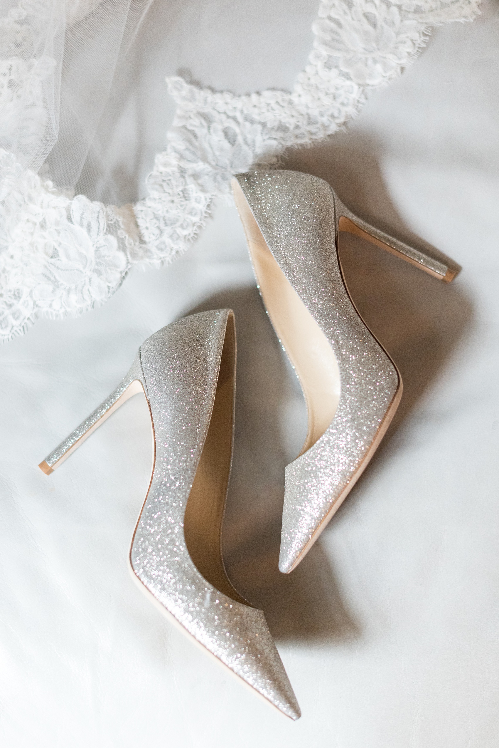 Beautiful wedding photos at The Carolina Inn at Chapel Hill, North Carolina by Mikkel Paige Photography. This venue has beautiful indoor and outdoor picture locations for ceremony, reception and bride and groom images. Click through to the post for more beautiful details like these glitter Jimmy Choo heels! #thecarolinainn #chapelhillweddingphotos #chapelhillwedding #southernwedding #mikkelpaige #southernwedding #weddingshoes #glitterheels #jimmychoos
