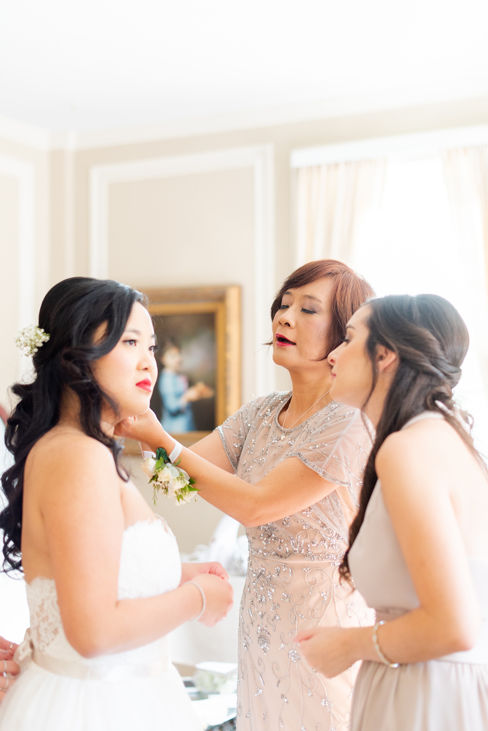 Getting ready wedding photos at Crabtree's Kittle House in Chappaqua, New York by Mikkel Paige Photography. This venue in Westchester county was the perfect place to capture the bride and bridesmaids getting ready in a country setting. The bride had timeless style with her strapless lace and tulle dress. Click through for more fall wedding inspiration from her day! #mikkelpaige #CrabtreesKittleHouse #WestchesterWeddingVenues #WestchesterWedding #SeptemberWedding #gettingready #bridestyle